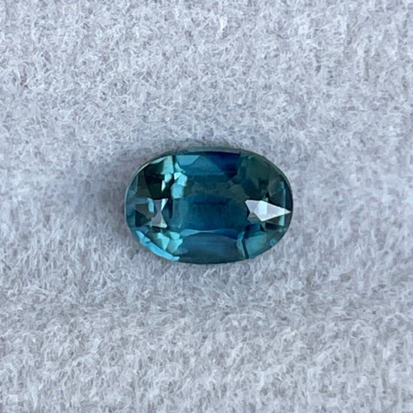 Loose teal sapphire by NASHGEMS, 0.73 ct certified natural blue-green oval-cut gemstone with heated treatment.