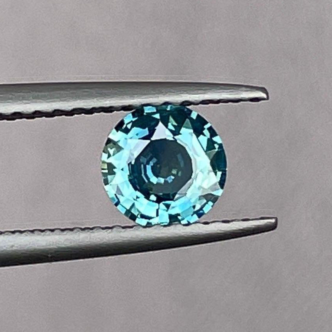 Natural 0.71 ct Teal Sapphire by NASHGEMS, well-cut gemstone with vibrant color and lustre, ideal for custom ring design.