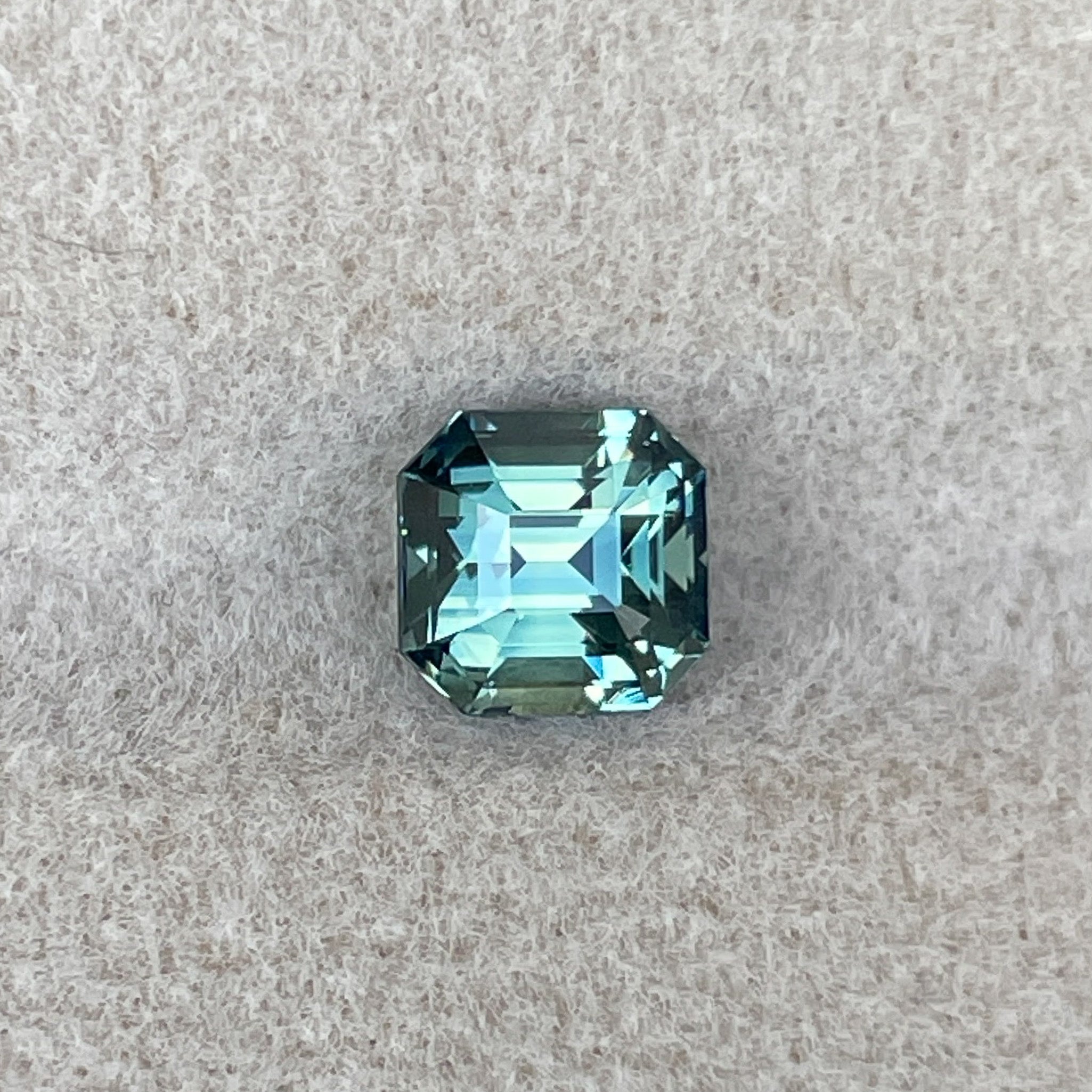Teal green sapphire gemstone, 1.36 ct emerald cut, no heat, loose NASHGEMS teal sapphire for engagement or custom jewelry.