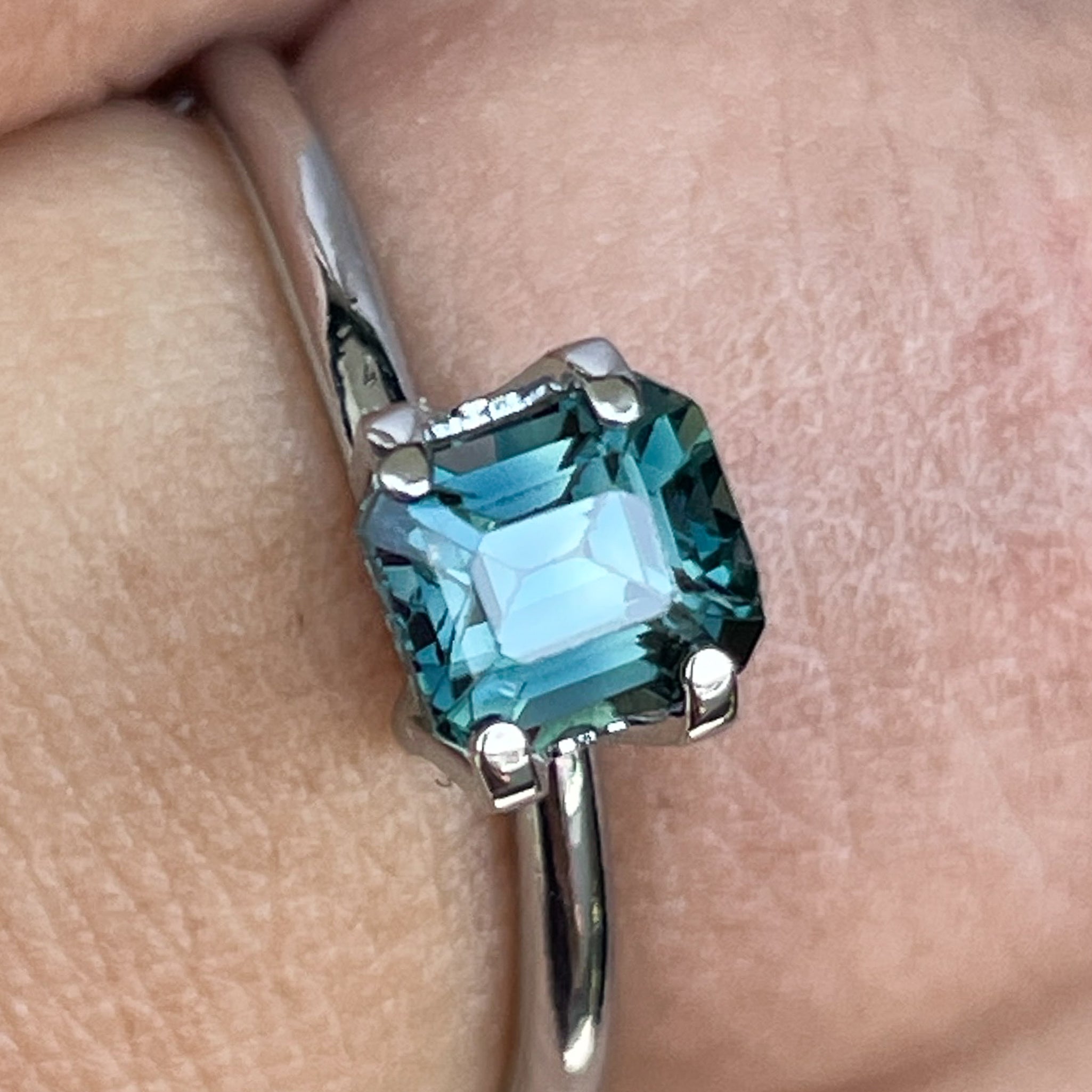 Natural teal blue sapphire 1.06 Ct emerald cut loose gemstone by NASHGEMS, perfect for engagement rings or custom jewelry.