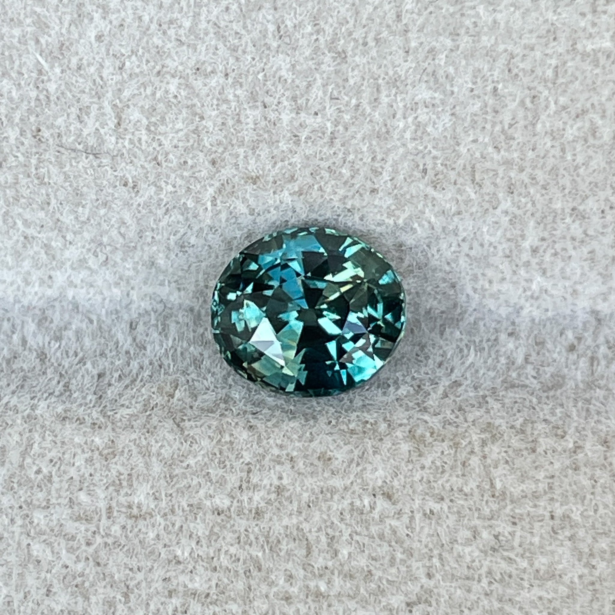 Teal blue-green oval cut sapphire gemstone, 1.56 Ct, loose gemstone from NASHGEMS for engagement or custom jewelry.
