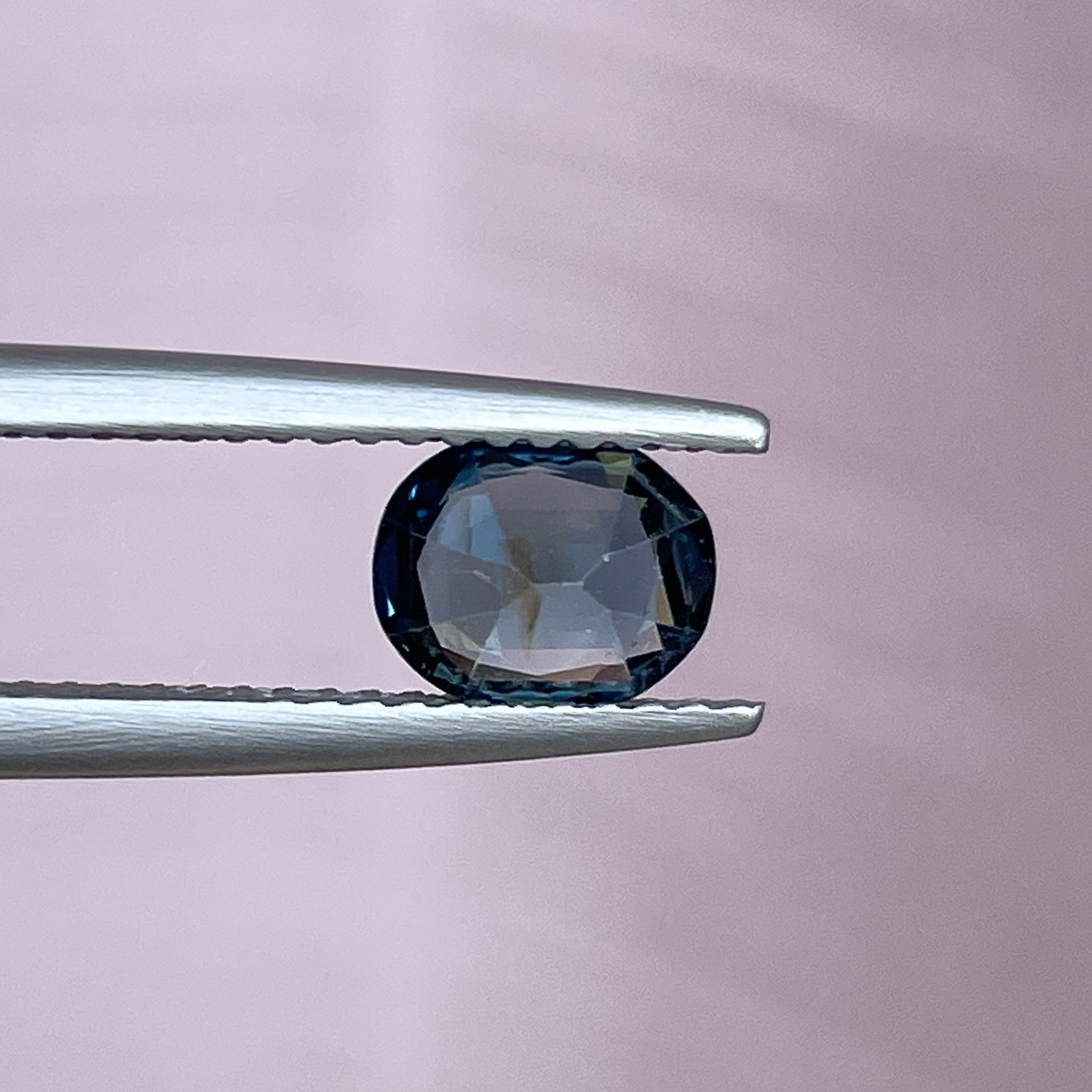 Natural teal sapphire 1.03 Ct oval cut loose gemstone from NASHGEMS, featuring vibrant blue-green hues for jewelry making.