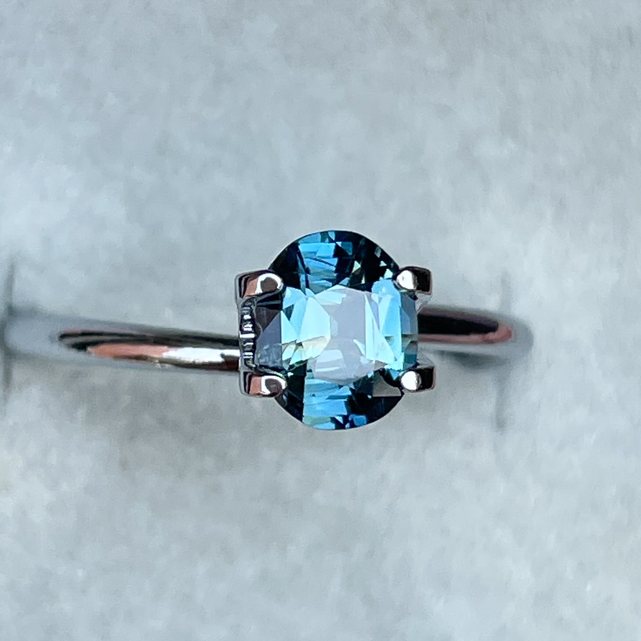 Natural teal sapphire 1.03 Ct oval cut loose gemstone from NASHGEMS, vibrant blue-green color, perfect for jewelry creation