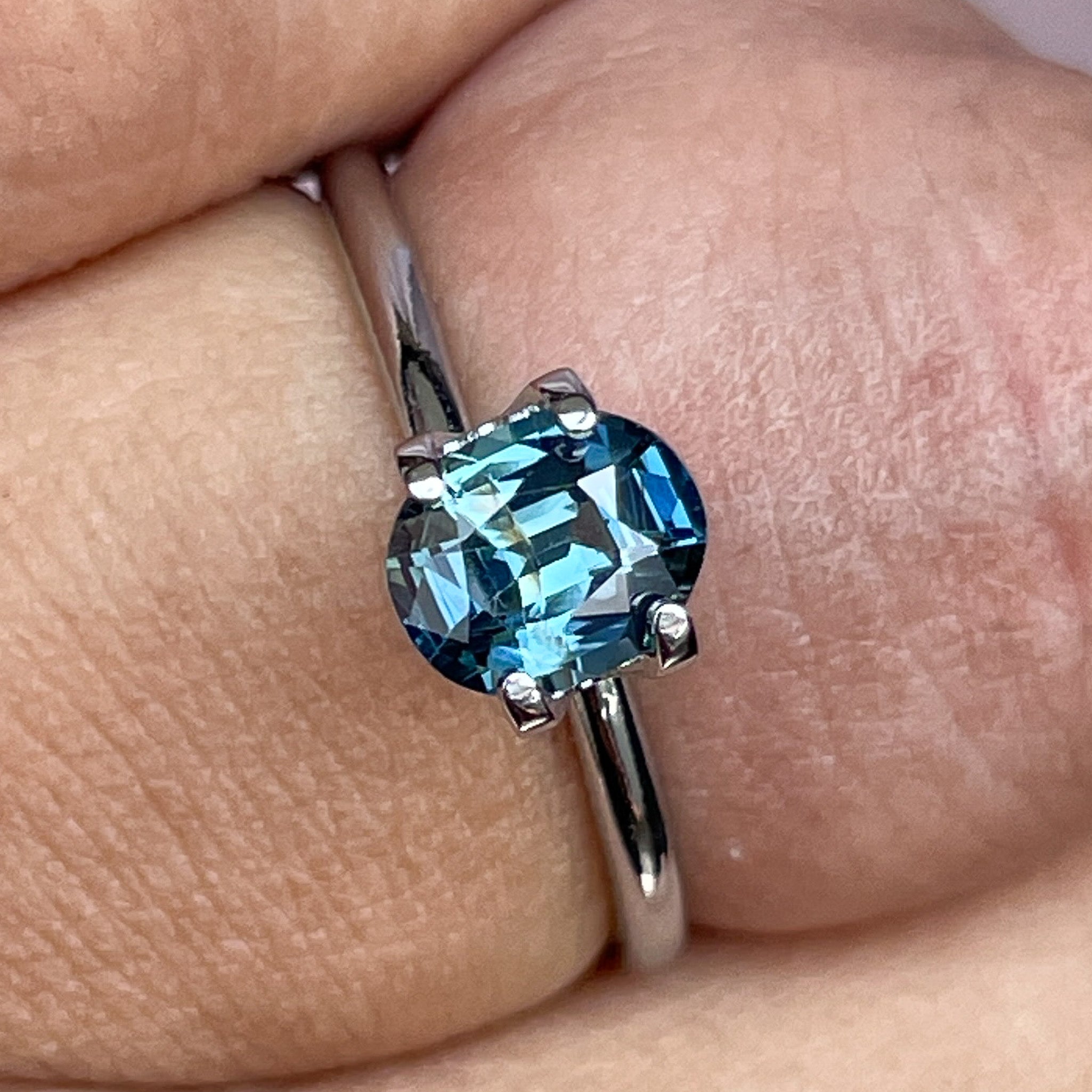 Natural teal sapphire 1.03 Ct oval cut loose gemstone from NASHGEMS, vibrant teal-blue-green color for jewelry making.