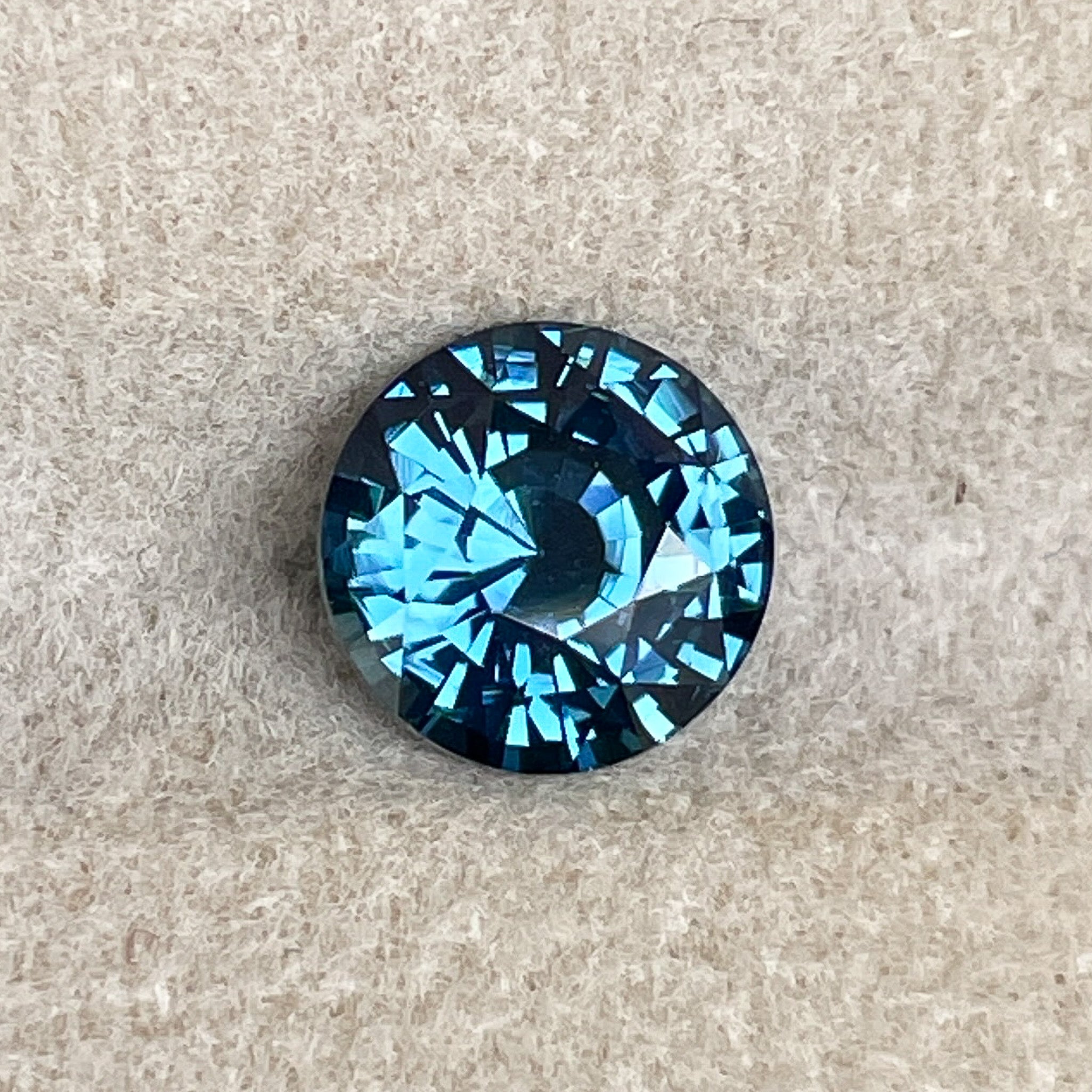 Natural teal blue sapphire, 2.10 Ct round cut loose gemstone by NASHGEMS, ideal for engagement rings or custom jewelry.