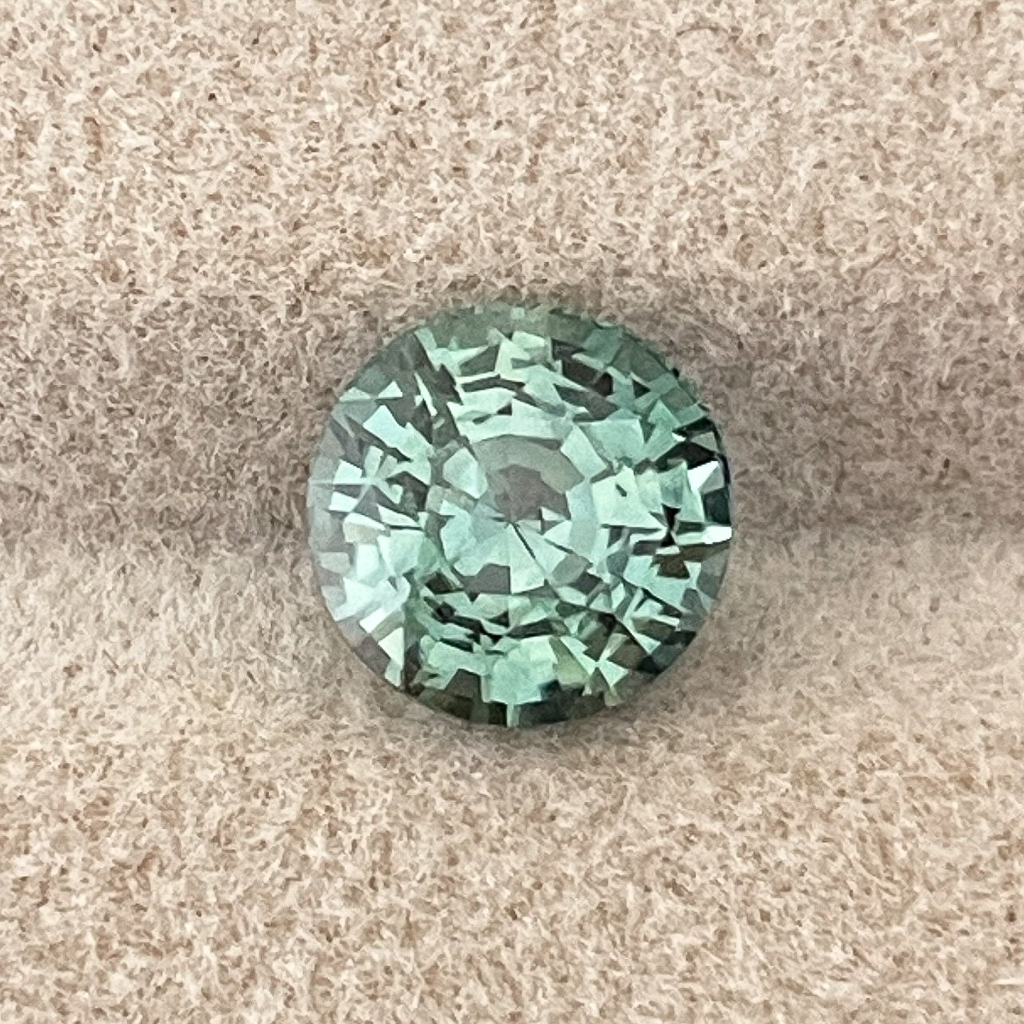 Natural green teal sapphire 2.50 Ct round cut loose gemstone by NASHGEMS, ideal for engagement rings or custom jewelry.