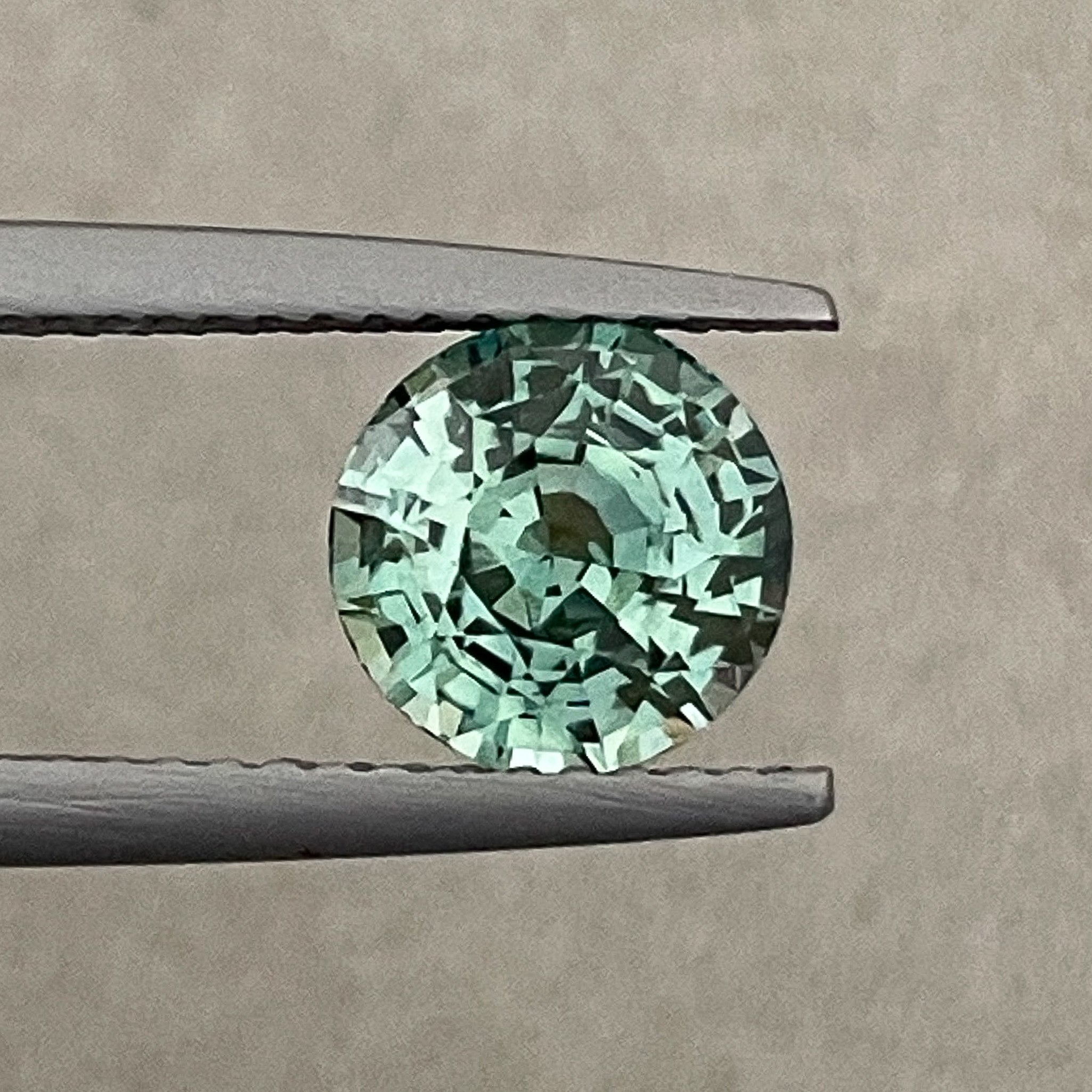 Teal green natural sapphire, 2.50 Ct round cut, loose no heat gemstone by NASHGEMS for engagement or custom jewelry.