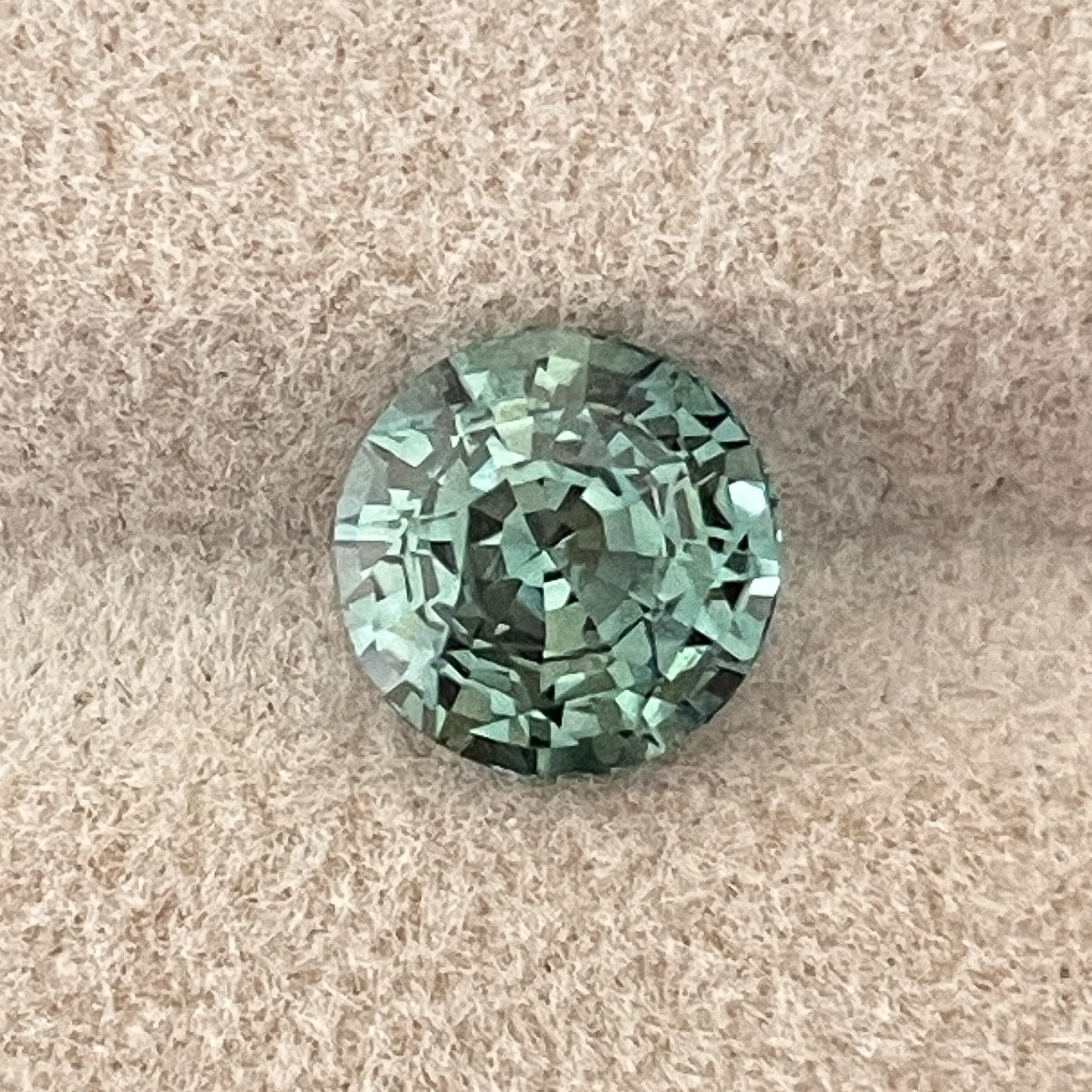 Natural green sapphire, 2.50 Ct round cut loose teal gemstone from NASHGEMS, ideal for engagement rings or custom jewelry designs.