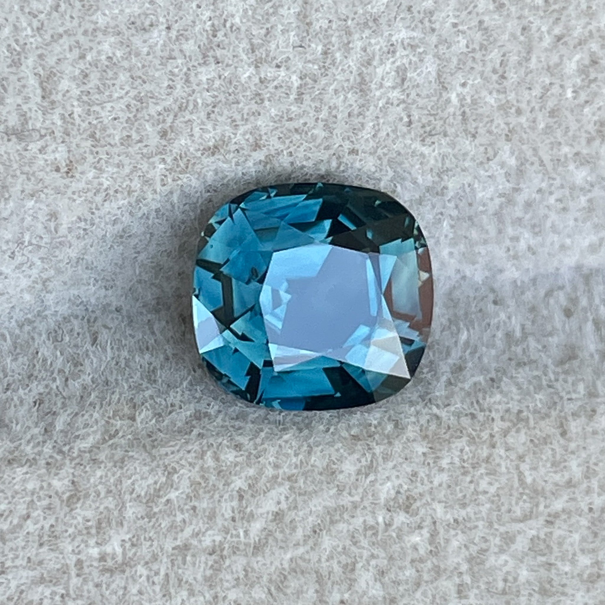 Natural teal sapphire cushion cut 2.02 carats from NASHGEMS, loose gemstone ideal for engagement rings or custom jewelry.