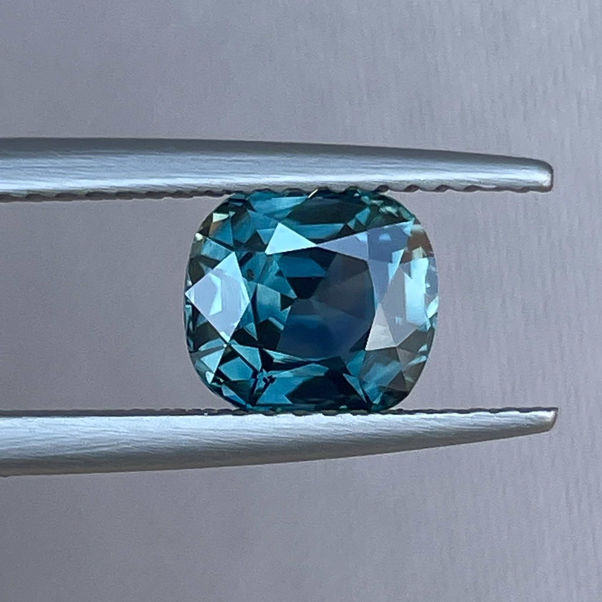 Natural teal sapphire 2.02 Ct cushion cut loose gemstone from NASHGEMS, ideal for engagement rings or custom jewelry.