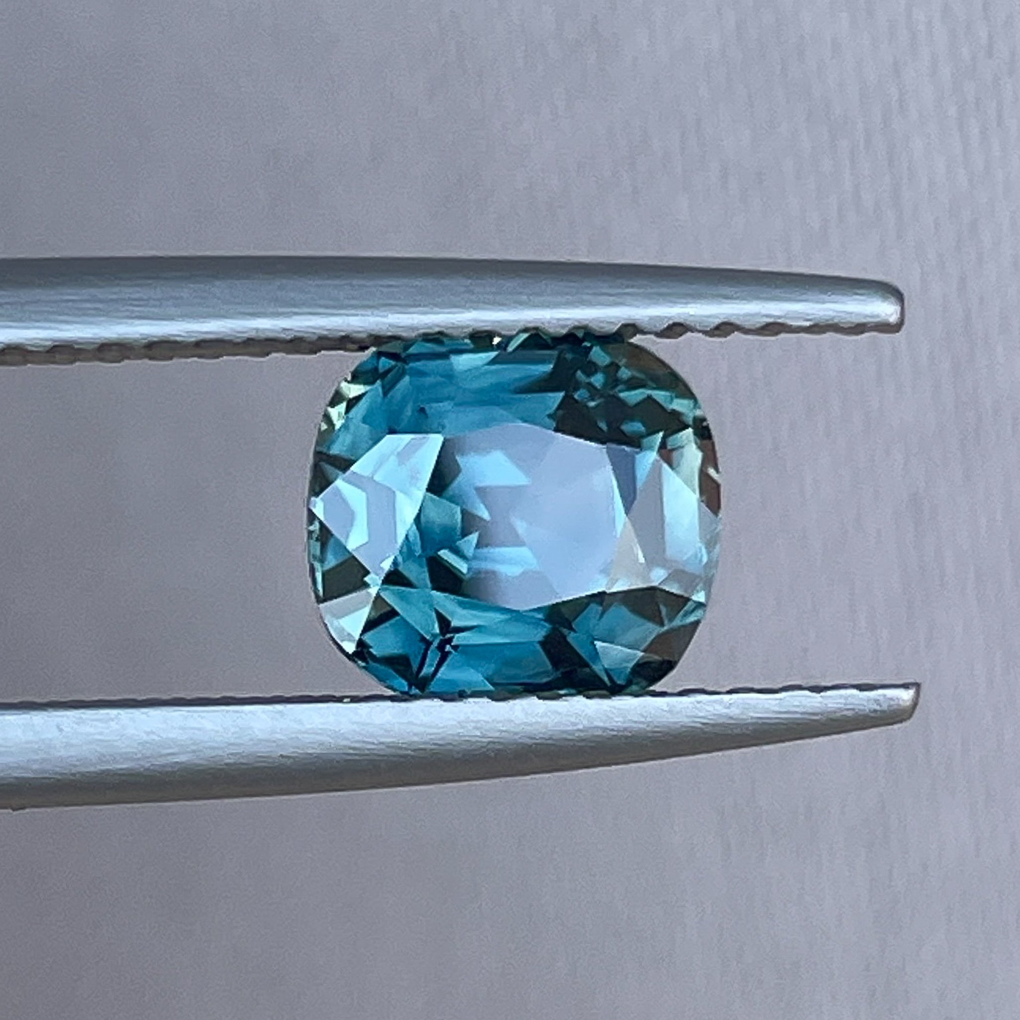 Natural teal sapphire 2.02 Ct cushion cut loose gemstone from NASHGEMS, ideal for engagement rings or custom jewelry.