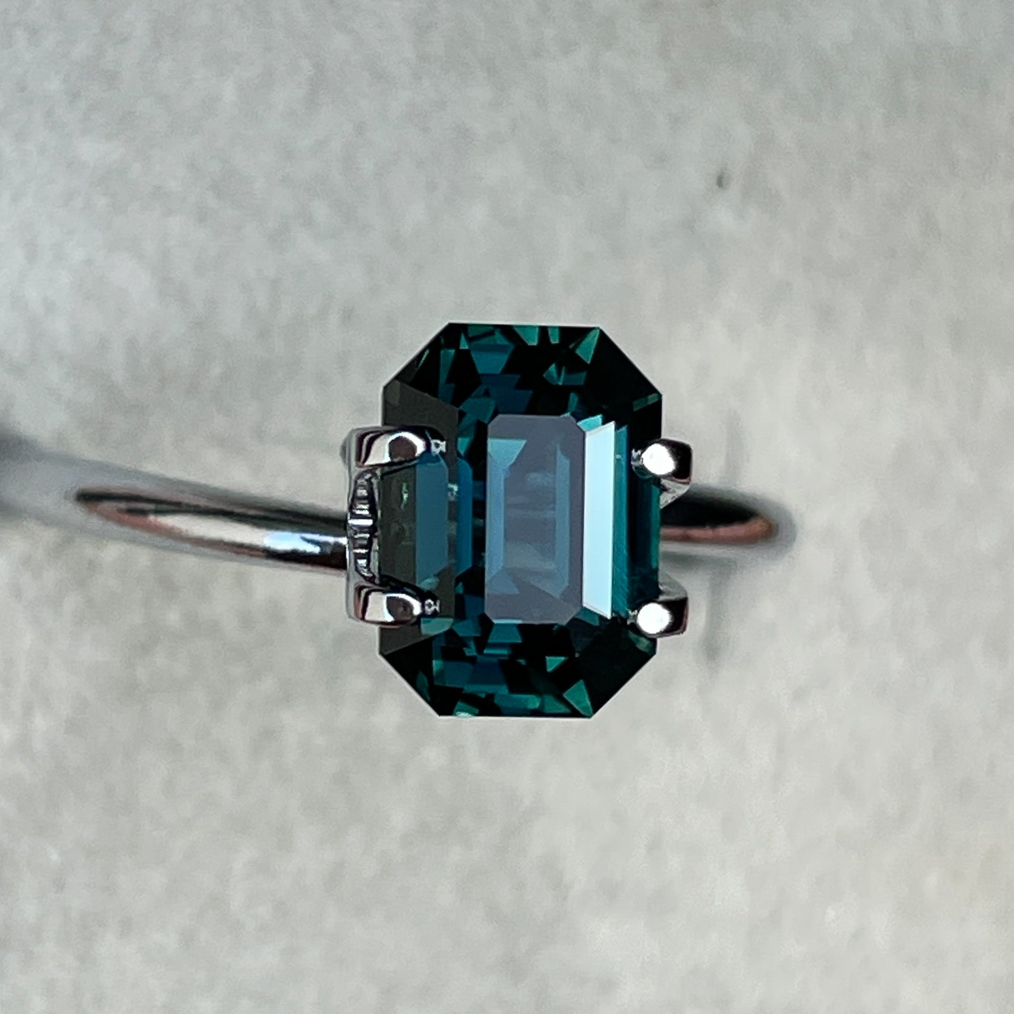 Natural teal blue-green sapphire, 2.18 Ct emerald cut, heat treated loose gemstone by NASHGEMS for engagement or custom jewelry.