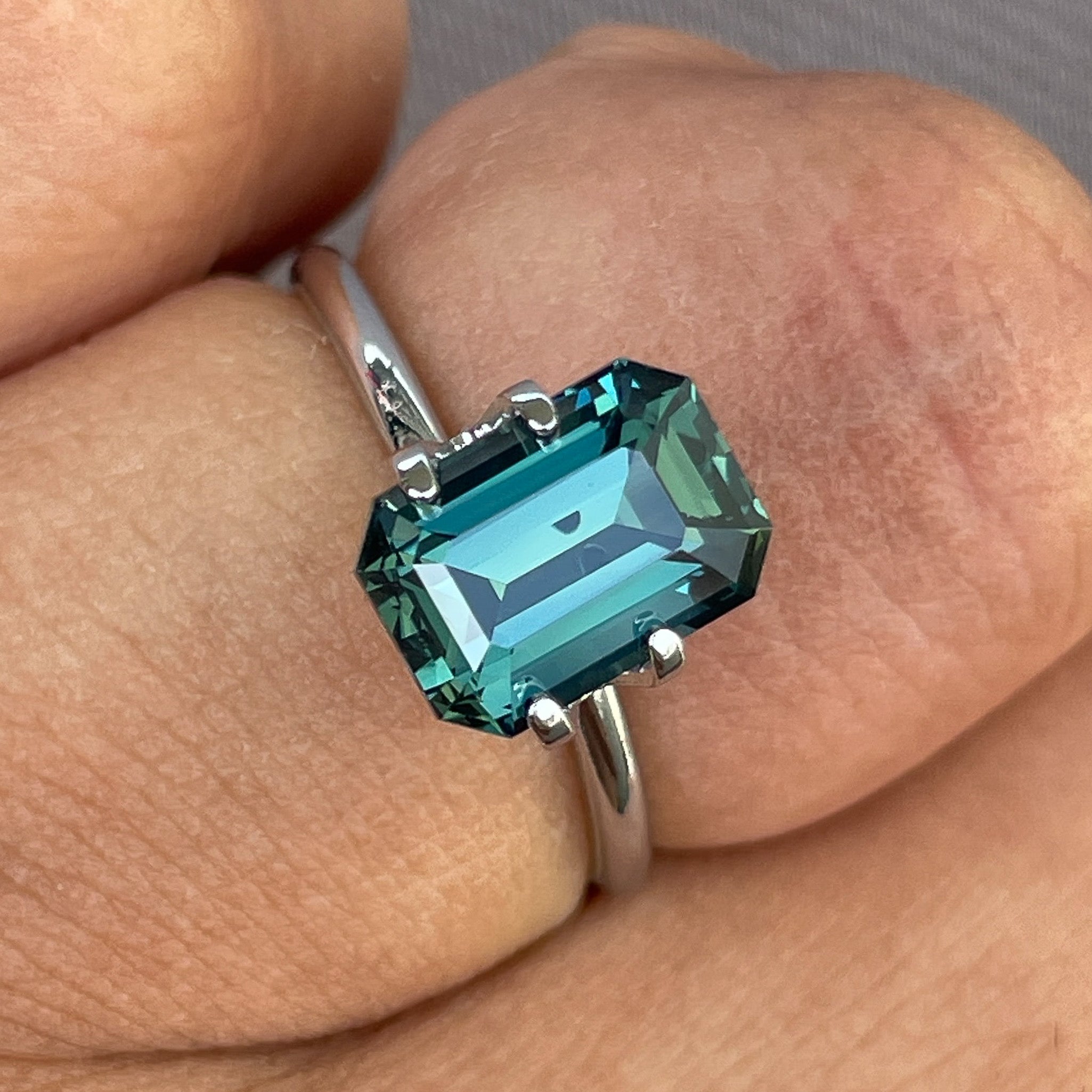 Natural teal blue-green sapphire, 3.71 ct emerald cut loose gemstone by NASHGEMS, ideal for engagement rings or custom jewelry.