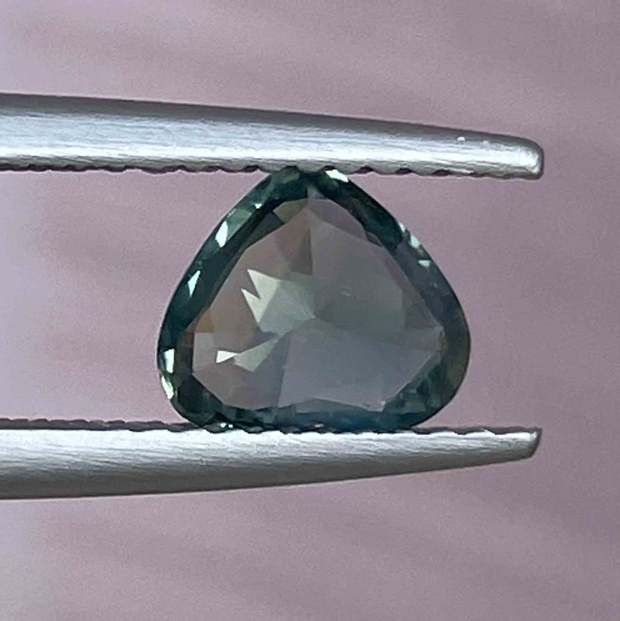 Teal green sapphire heart-shaped loose gemstone, 1.12ct, heat treated, perfect for engagement rings or custom jewelry by NASHGEMS.