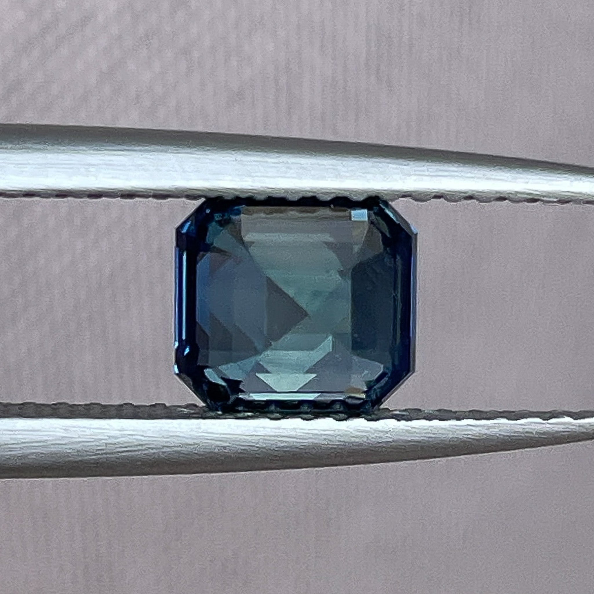 Natural teal blue-green sapphire 1.75 Ct emerald cut loose gemstone by NASHGEMS, showcasing vibrant bi-color sapphire for jewelry.