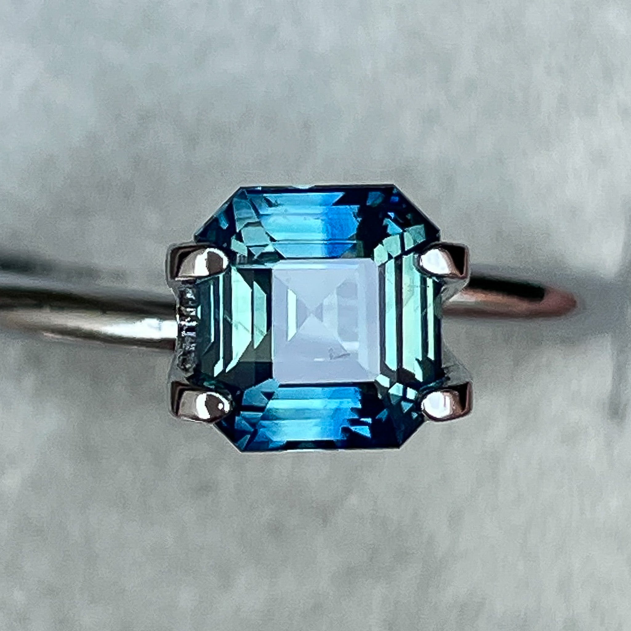 Natural teal blue-green sapphire 1.75 Ct emerald cut loose gemstone from NASHGEMS, ideal for engagement rings.