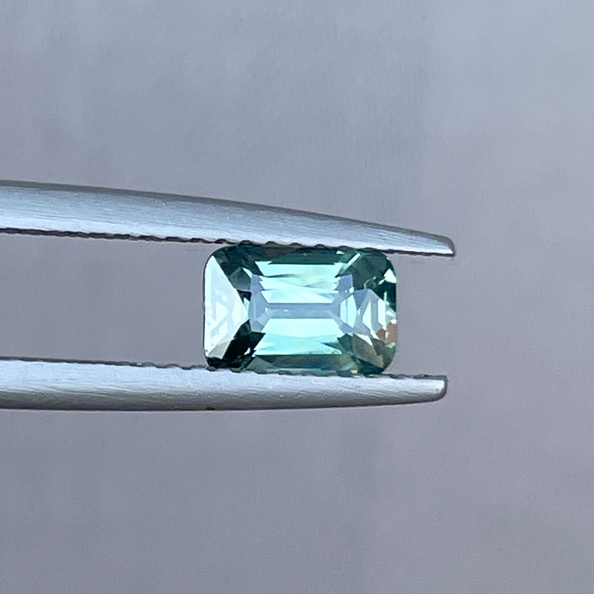 Natural pale green sapphire, 1.14 ct cushion cut, loose teal sapphire by NASHGEMS for engagement or custom jewelry.