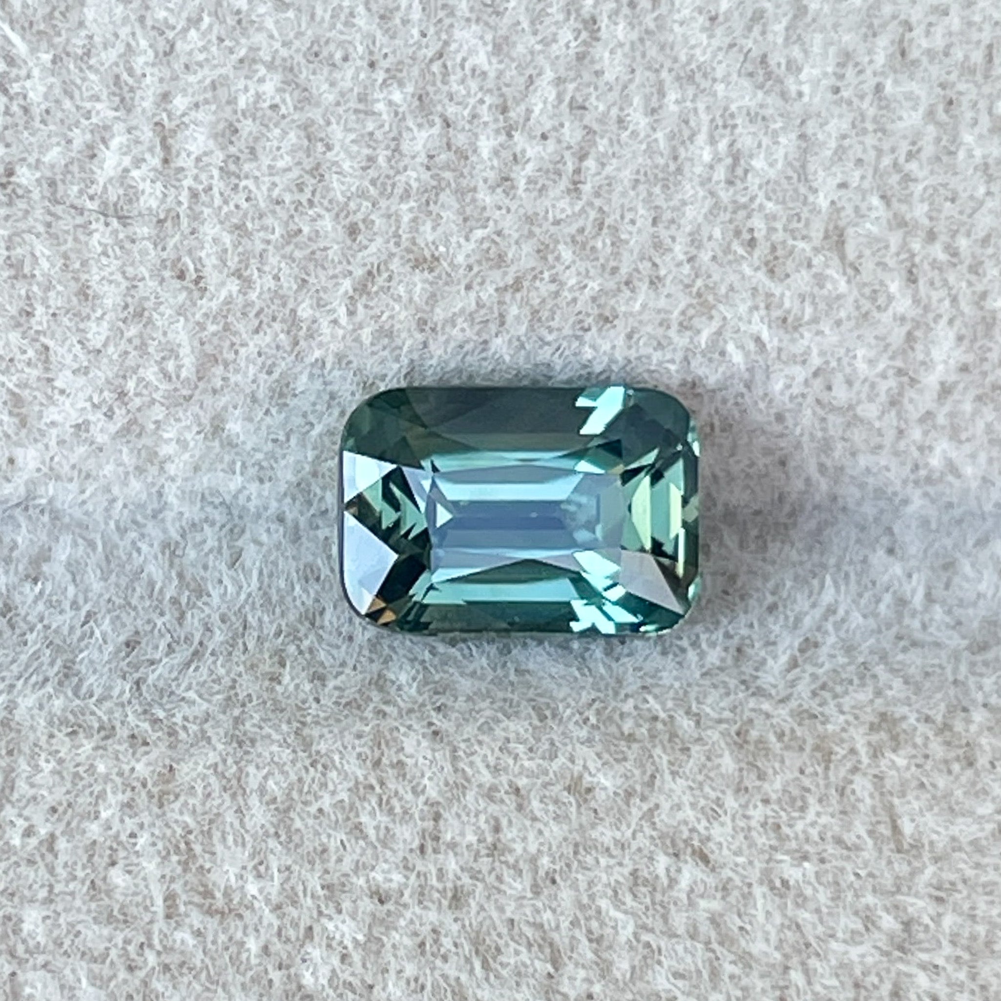 Natural pale green teal sapphire, 1.14 Ct cushion cut loose gemstone by NASHGEMS, ideal for engagement or custom jewelry.