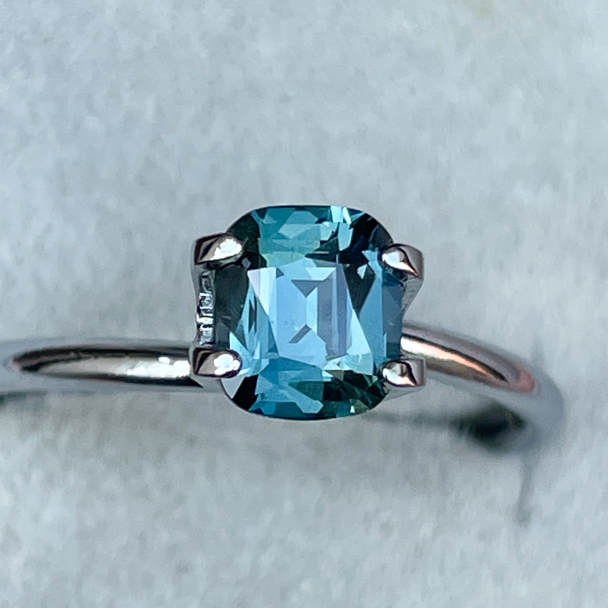 Natural teal blue sapphire 1.18 Ct cushion cut loose gemstone by NASHGEMS, ideal for engagement rings or custom jewelry.