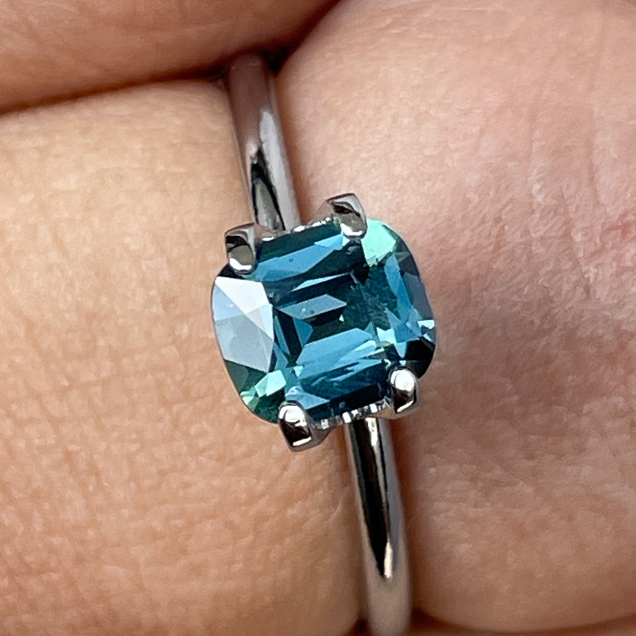 Natural teal blue sapphire 1.18 ct cushion cut loose gemstone from NASHGEMS, ideal for engagement rings or custom jewelry.