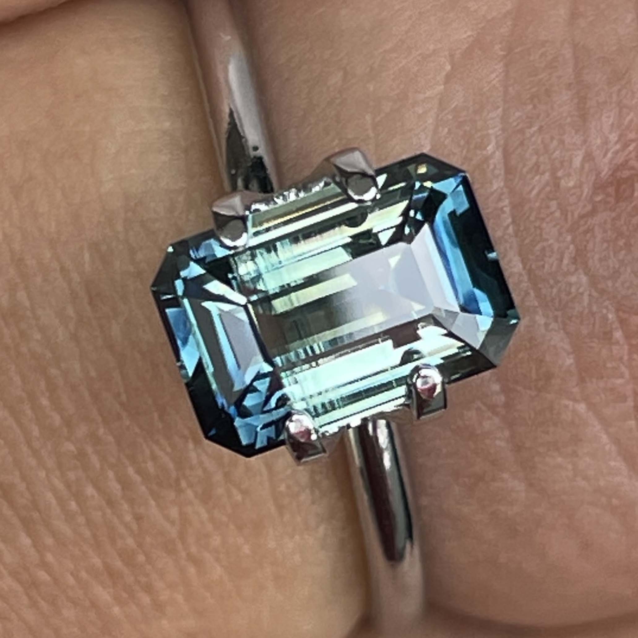 Teal natural bi-color sapphire with 2.07 carats in emerald cut, no heat treatment, from NASHGEMS, ideal for engagement rings.