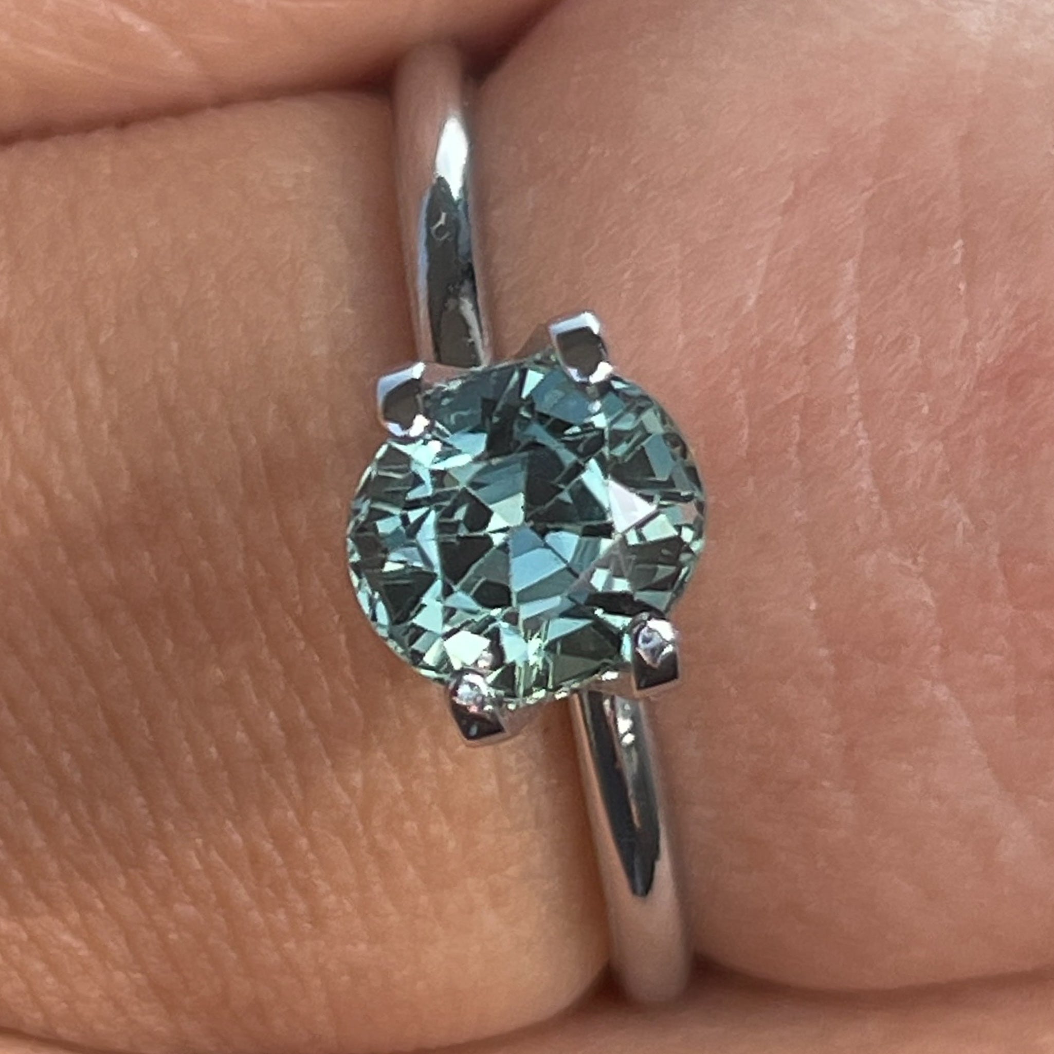 Natural teal sapphire loose gemstone, 1.65 ct oval cut by NASHGEMS, ideal for engagement rings or custom jewelry.