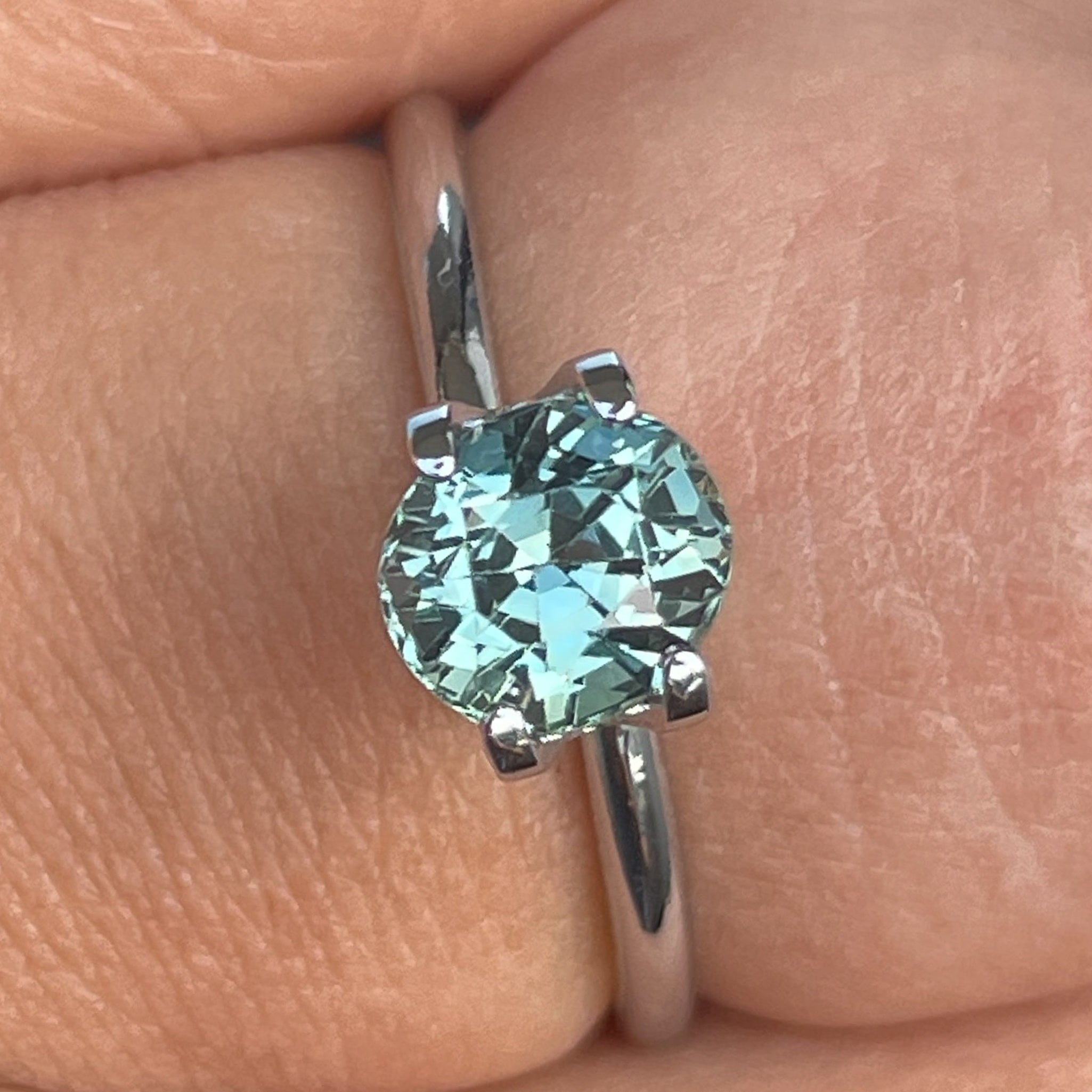 Natural teal sapphire loose gemstone, 1.65 ct oval cut by NASHGEMS, ideal for engagement rings or custom jewelry designs.