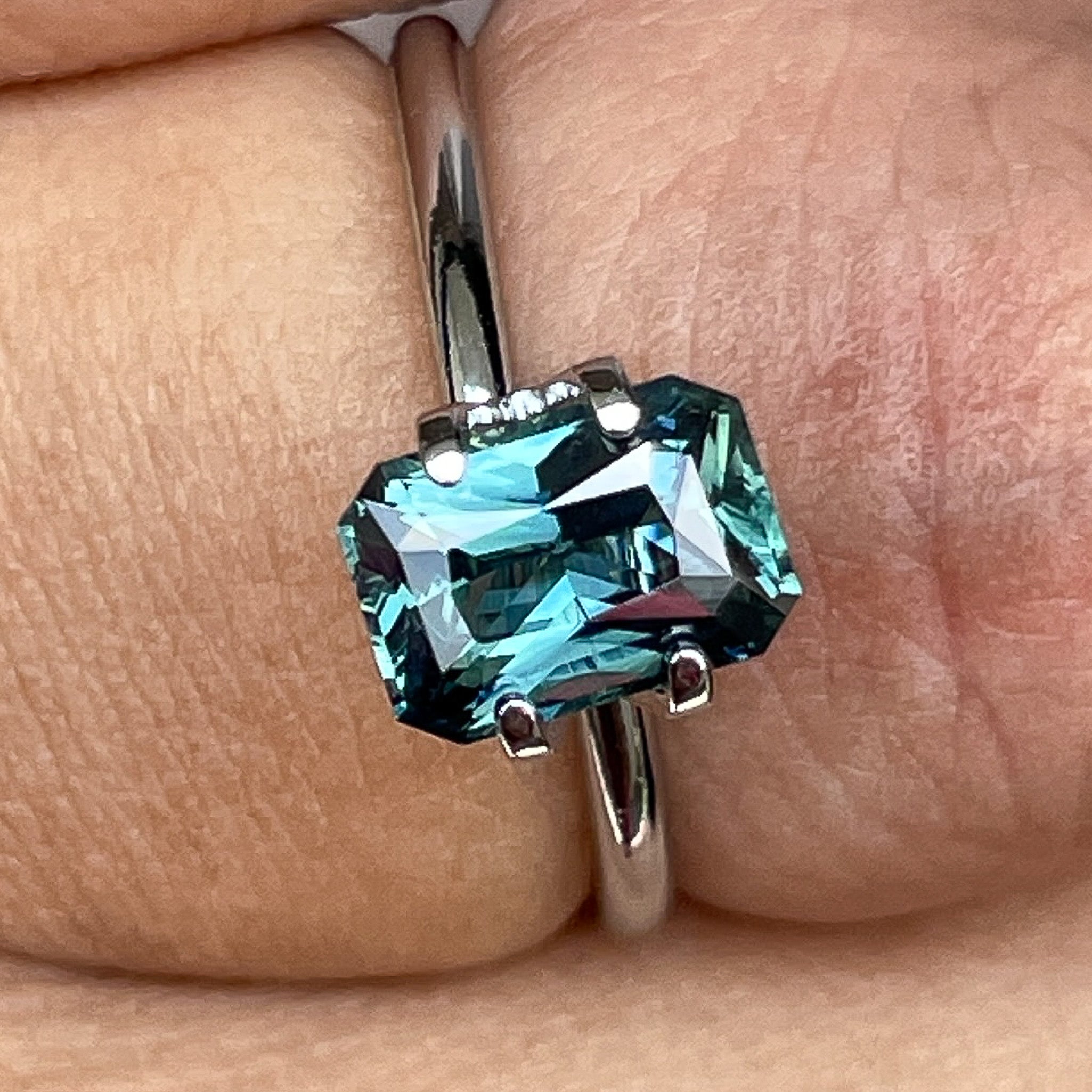 Natural teal blue-green sapphire, 1.71 Ct radiant cut loose gemstone by NASHGEMS, ideal for engagement rings or custom jewelry.