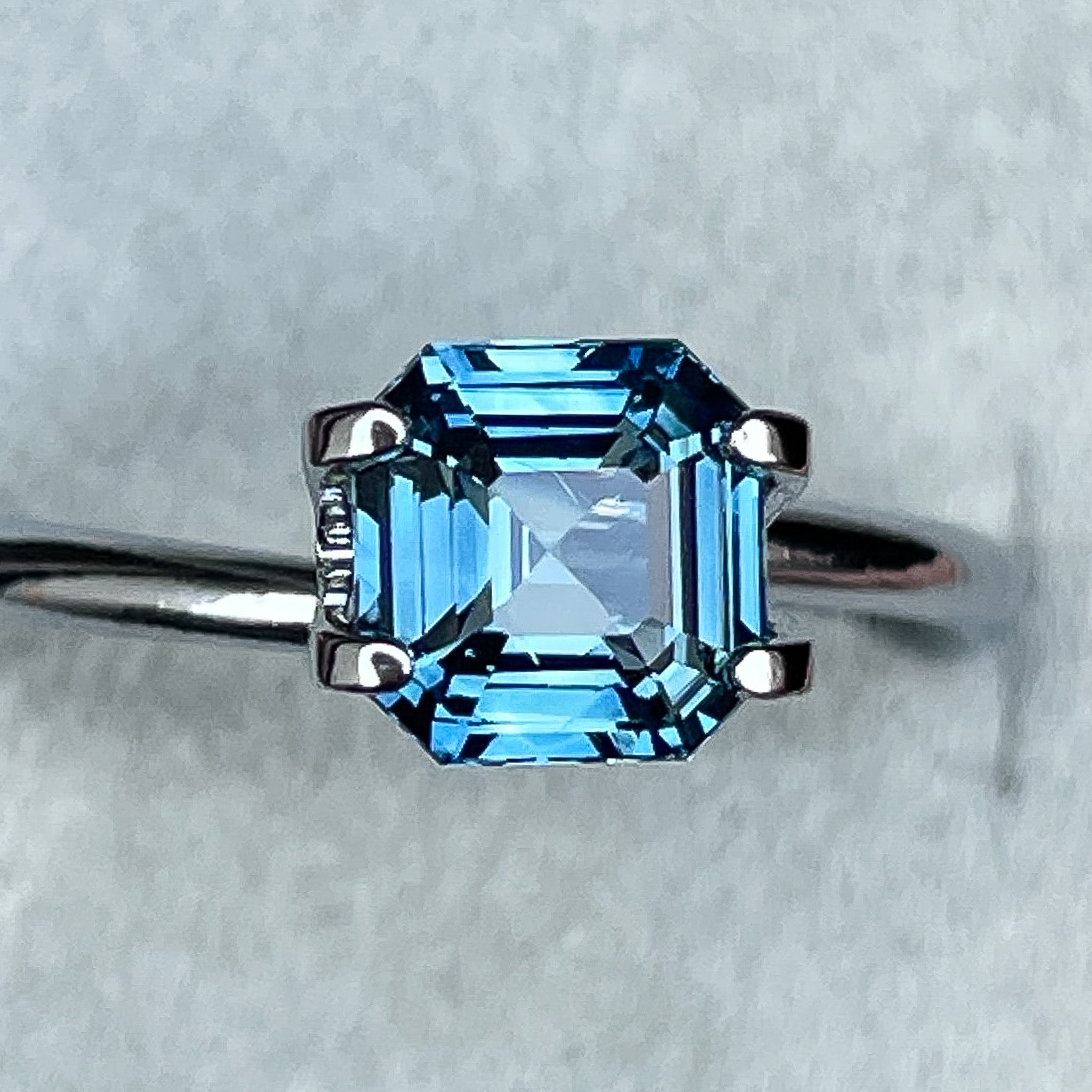Natural teal blue sapphire 1.52 Ct emerald cut loose gemstone from NASHGEMS, ideal for engagement rings or custom jewelry.