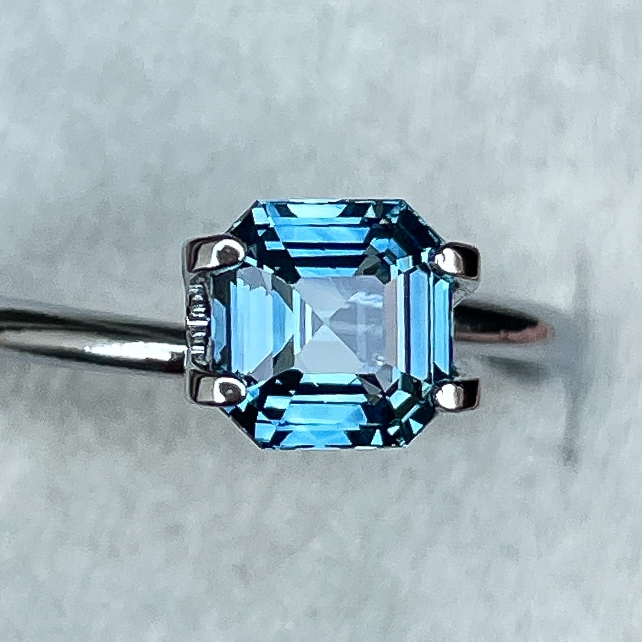 Natural teal blue sapphire 1.52 Ct emerald cut loose gemstone from NASHGEMS, ideal for engagement rings or custom jewelry designs.