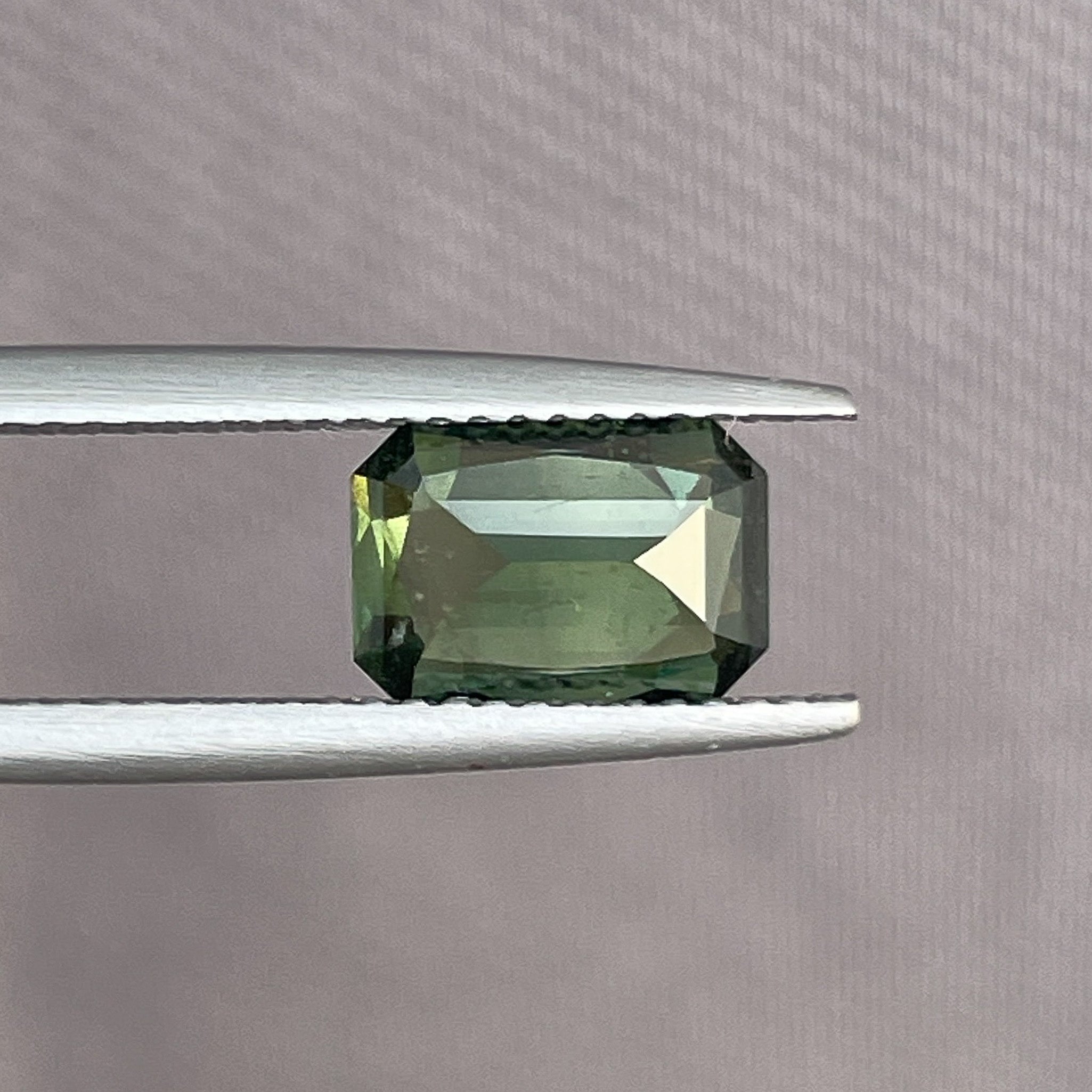 Teal green sapphire with 2.36 Ct radiant cut from NASHGEMS, heat-treated loose gemstone for jewelry or engagement rings.