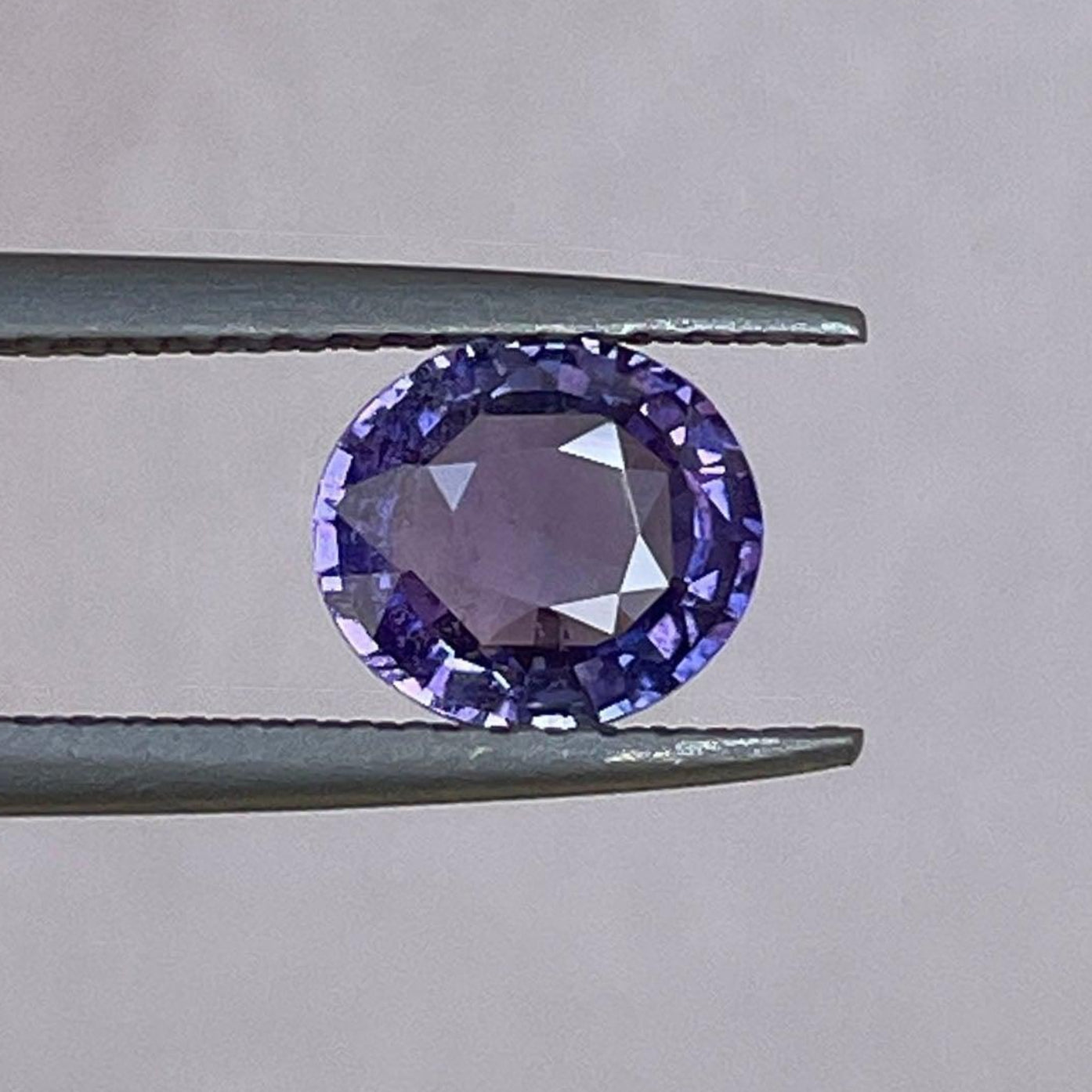 Loose violet sapphire gemstone with 1.28 carats, natural purple indigo mauve sapphire for custom jewelry design.