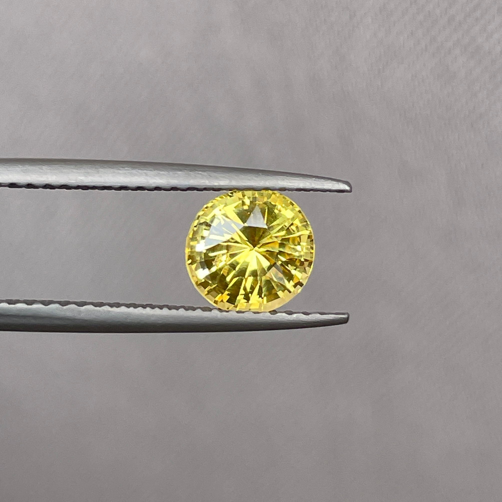yellow round sapphire 1.58