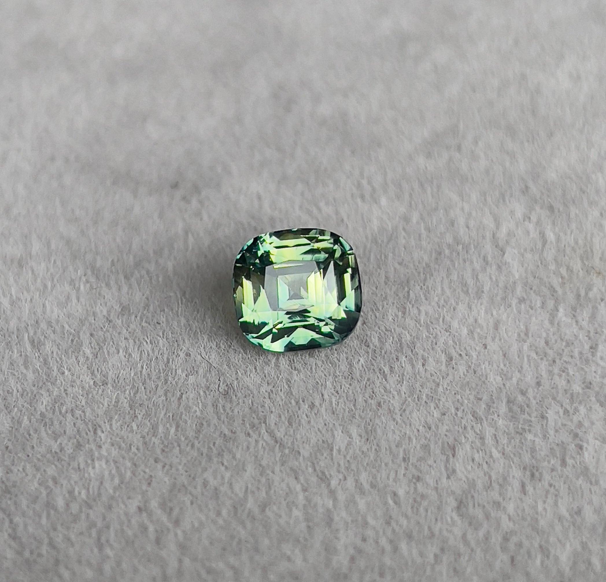 teal blue green parti sapphire cushion cut gem 