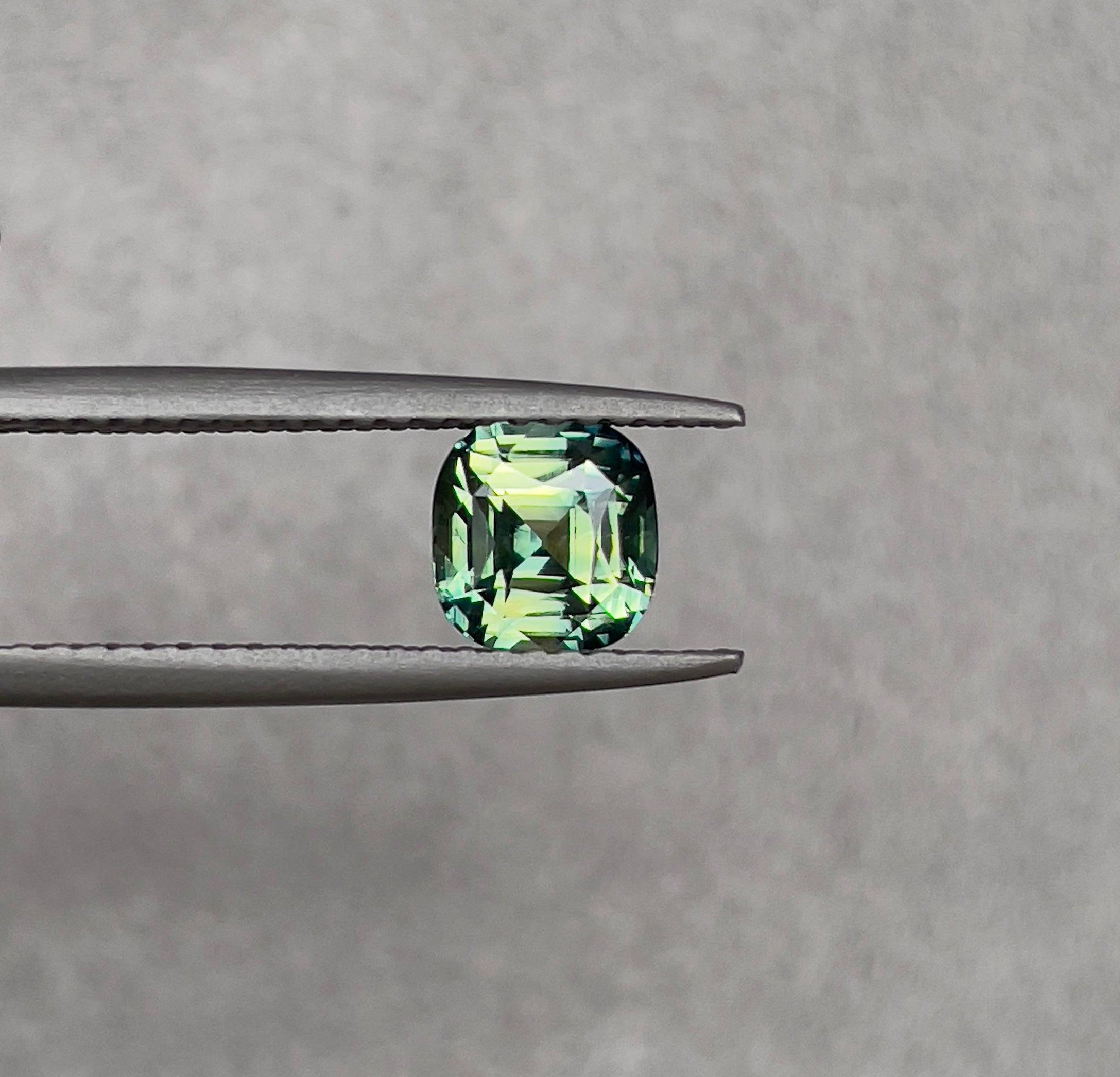 teal blue green parti sapphire cushion cut gem 