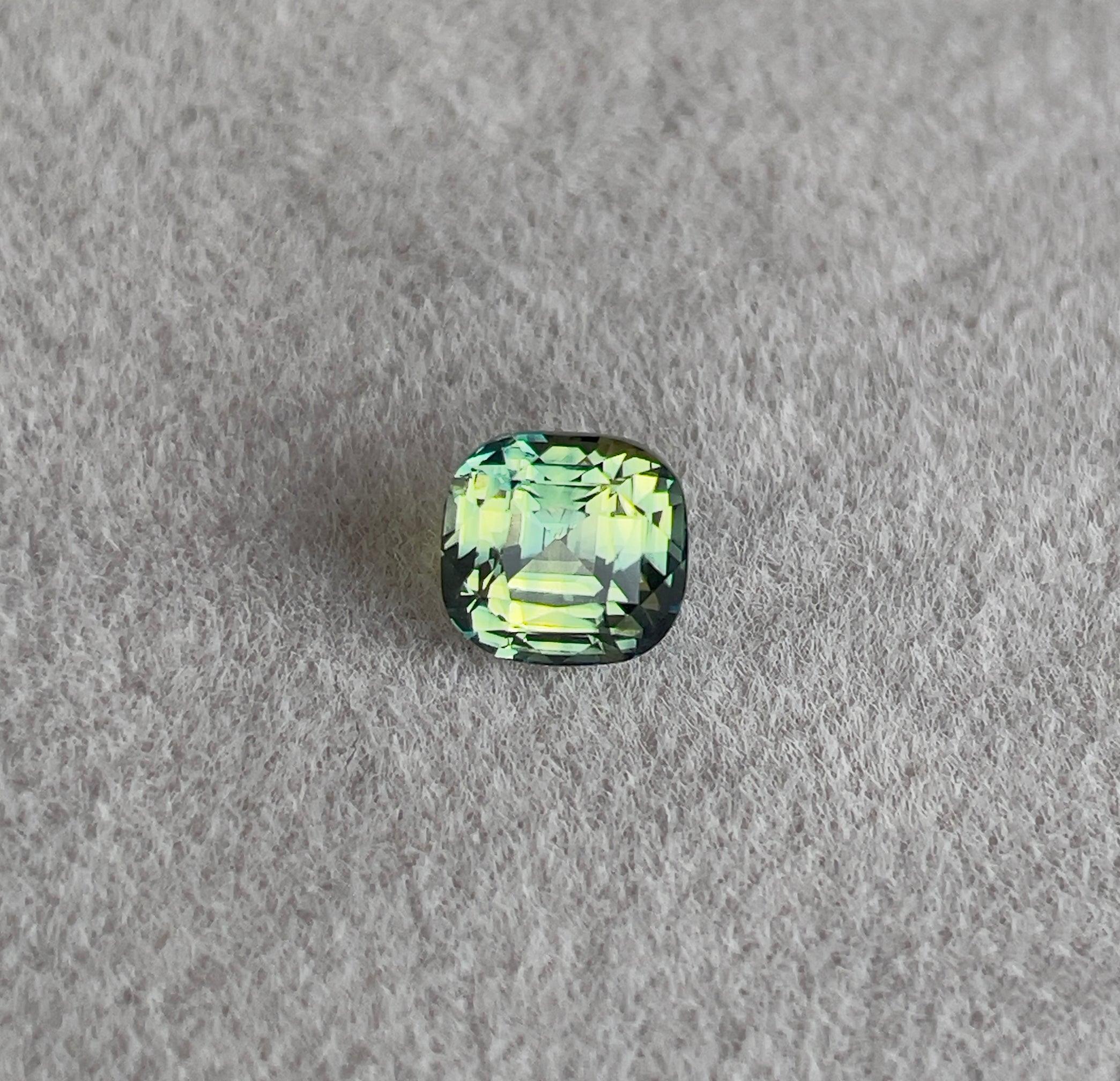 teal blue green parti sapphire cushion cut gem 