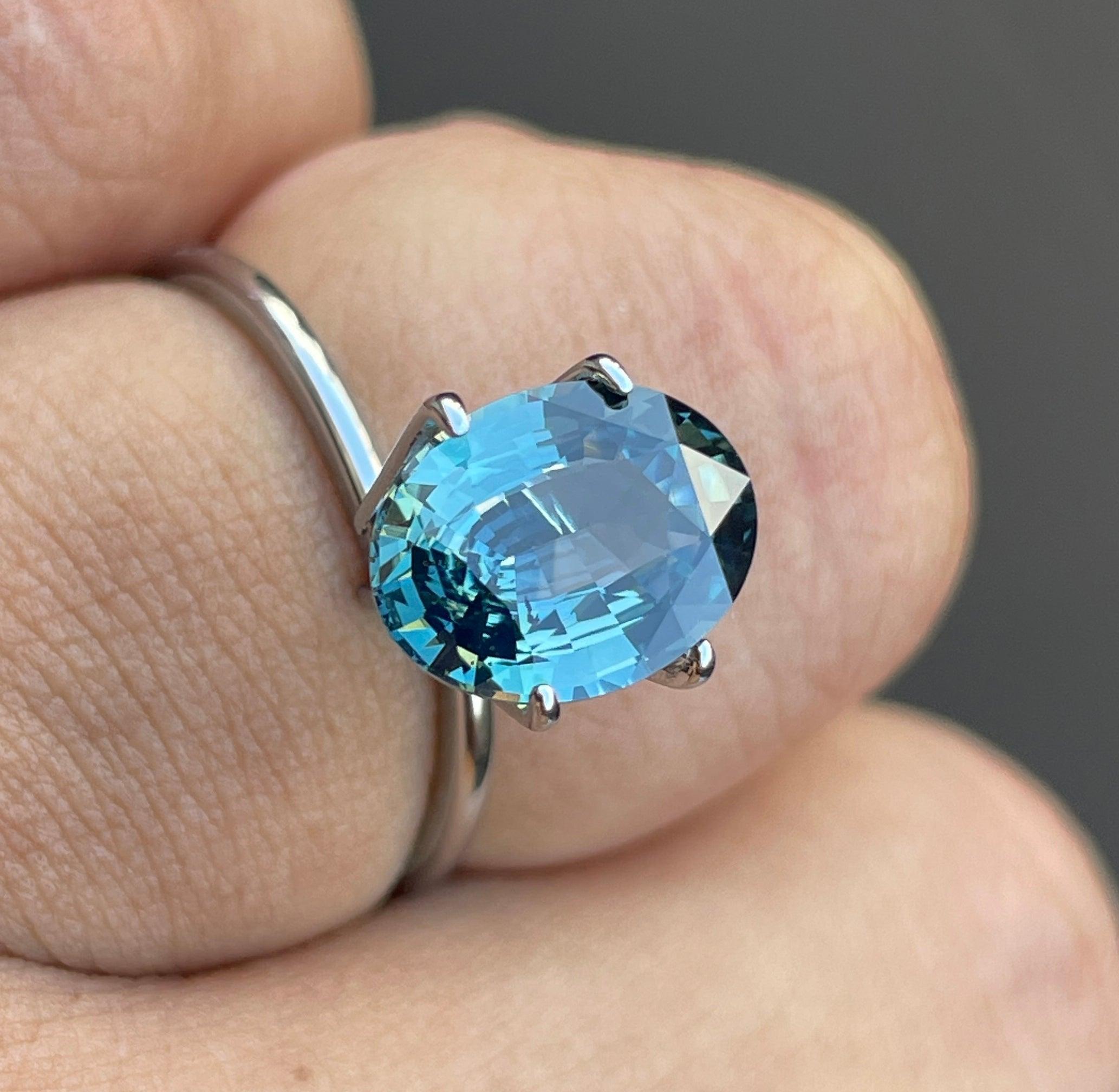 teal blue green parti sapphire oval cut gem 