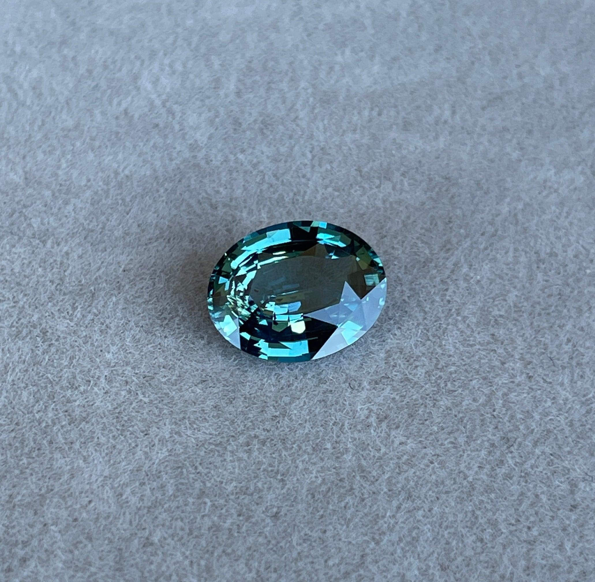 teal blue green parti sapphire oval cut gem 