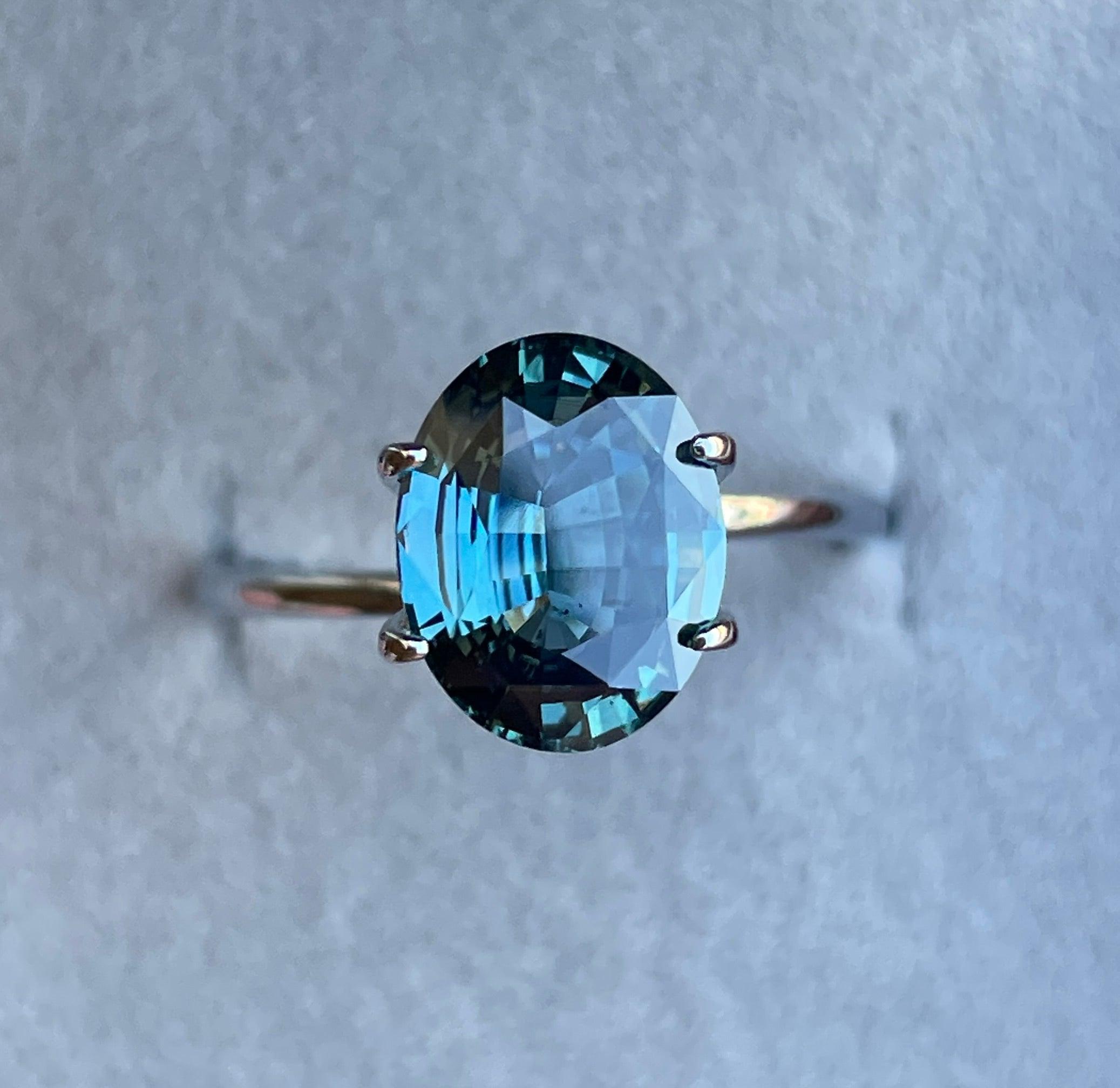 teal blue green parti sapphire oval cut gem 