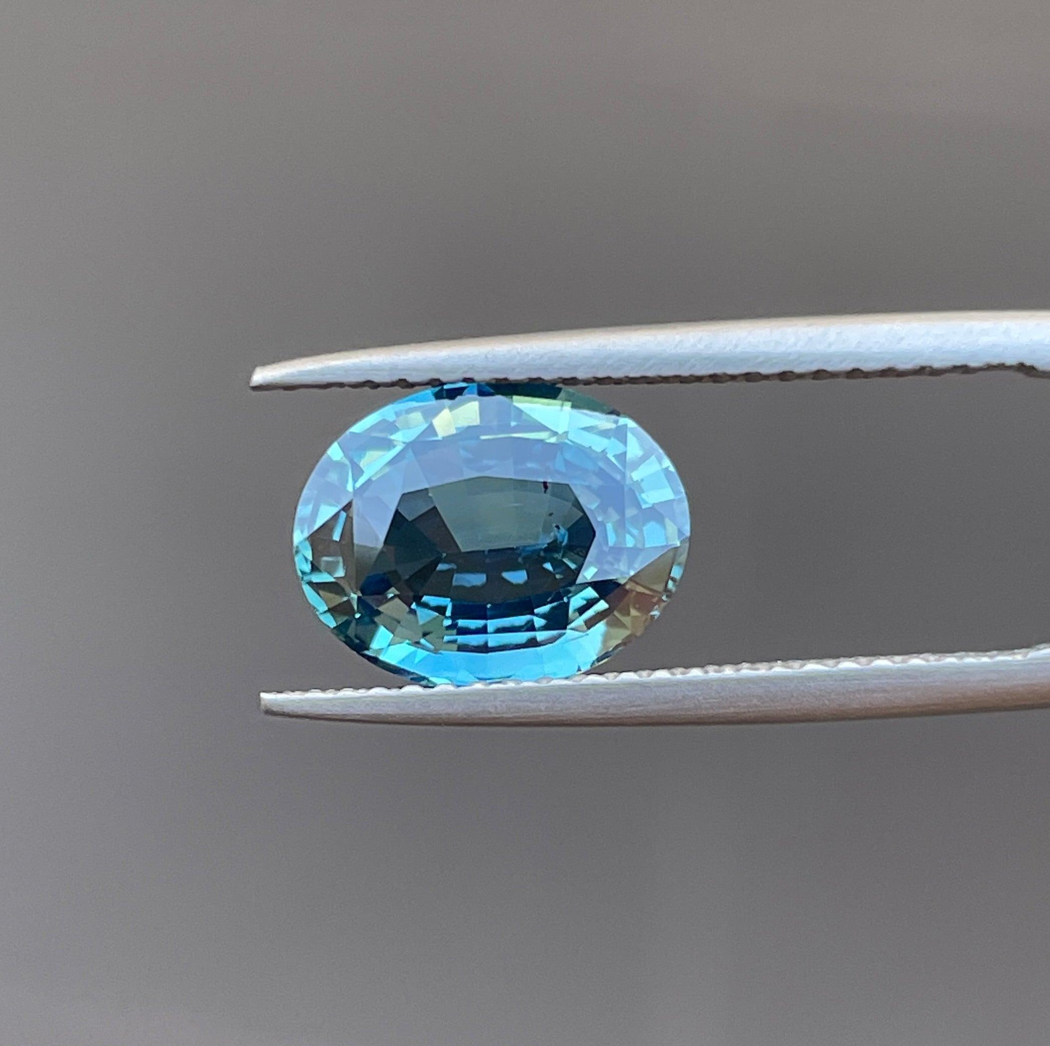 teal blue green parti sapphire oval cut gem 