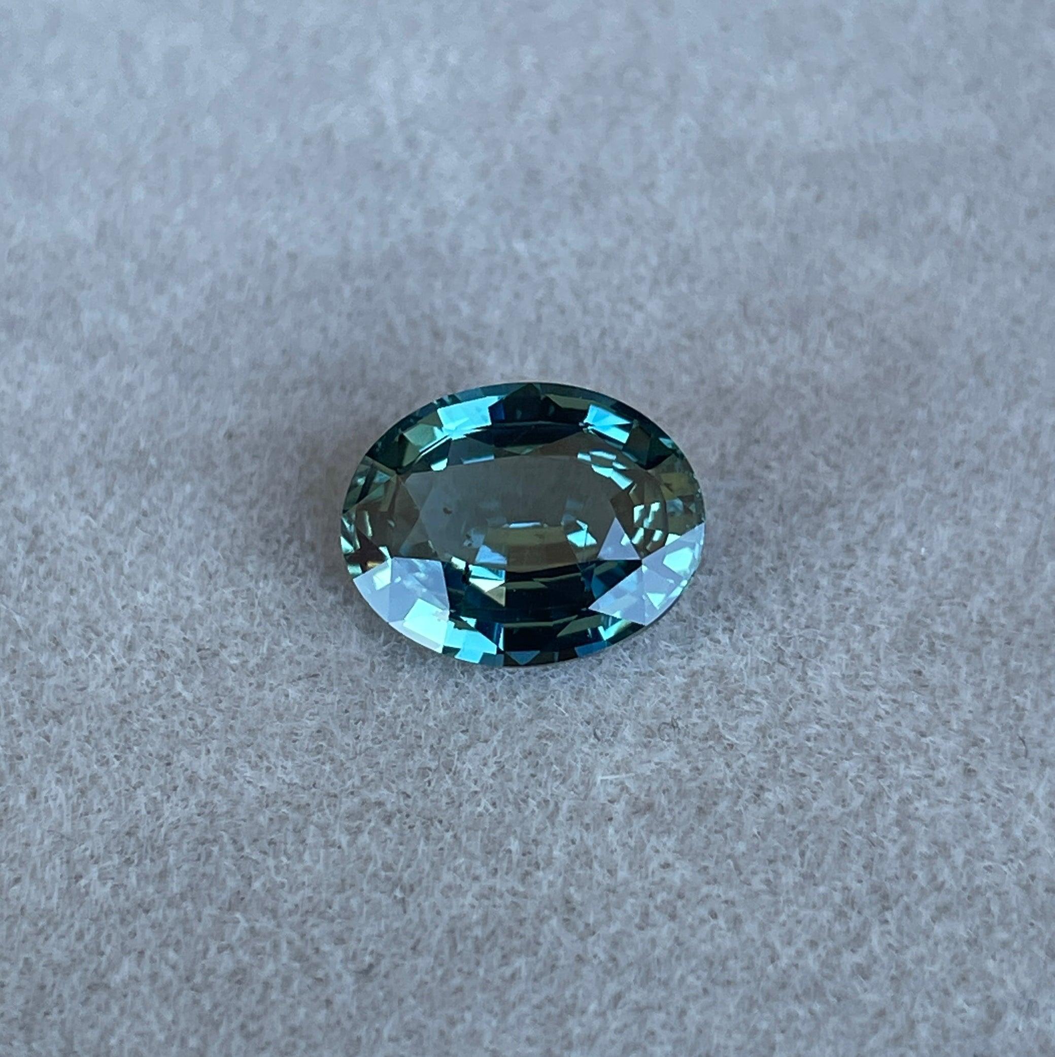 teal blue green parti sapphire oval cut gem 
