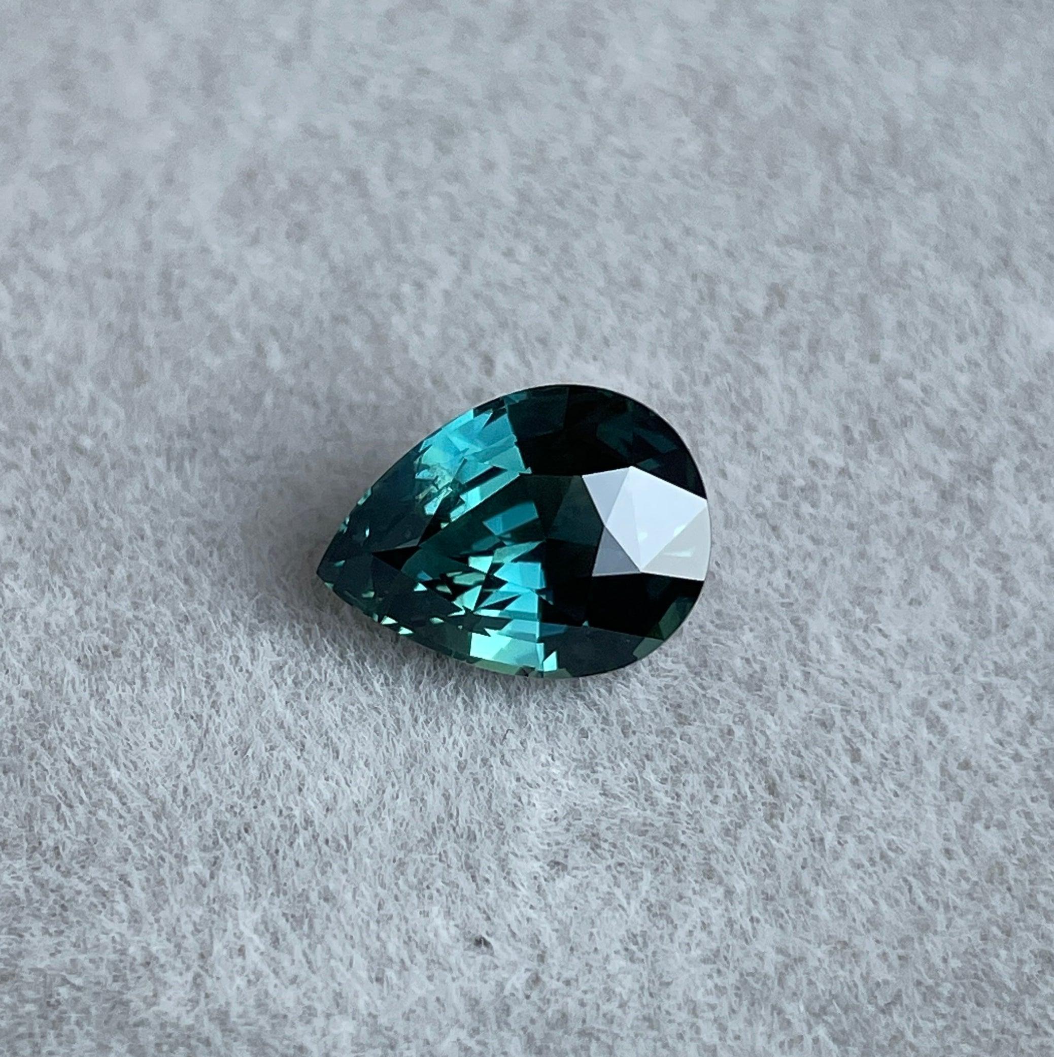 teal blue green parti sapphire pear drop cut gem 